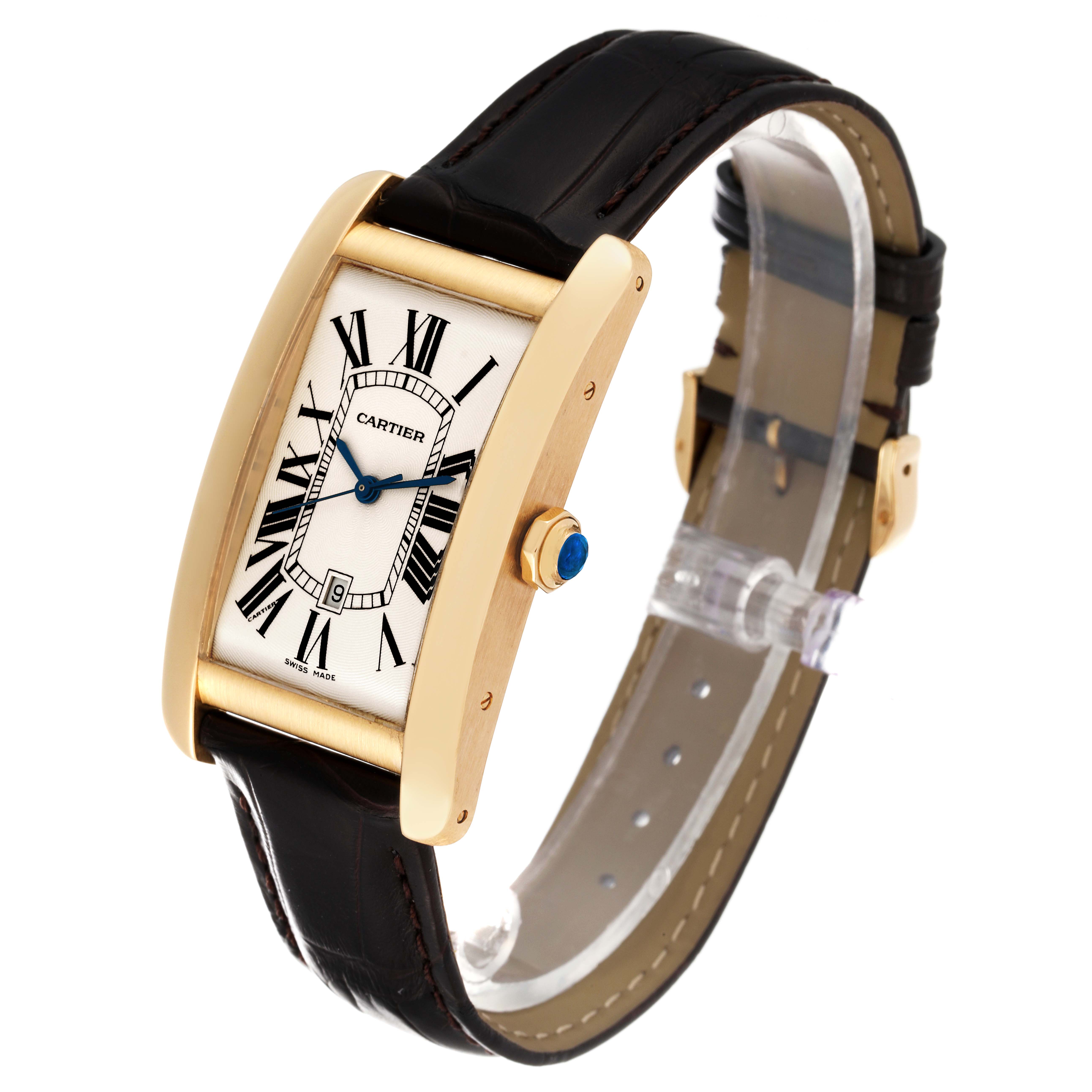 The image shows a Cartier Tank Americaine W2603156 Men
s Yellow Gold Silver Dial W2603156 Men
s Yellow Gold Silver Dial watch at a three-quarter angle, highlighting its dial, case, and strap.