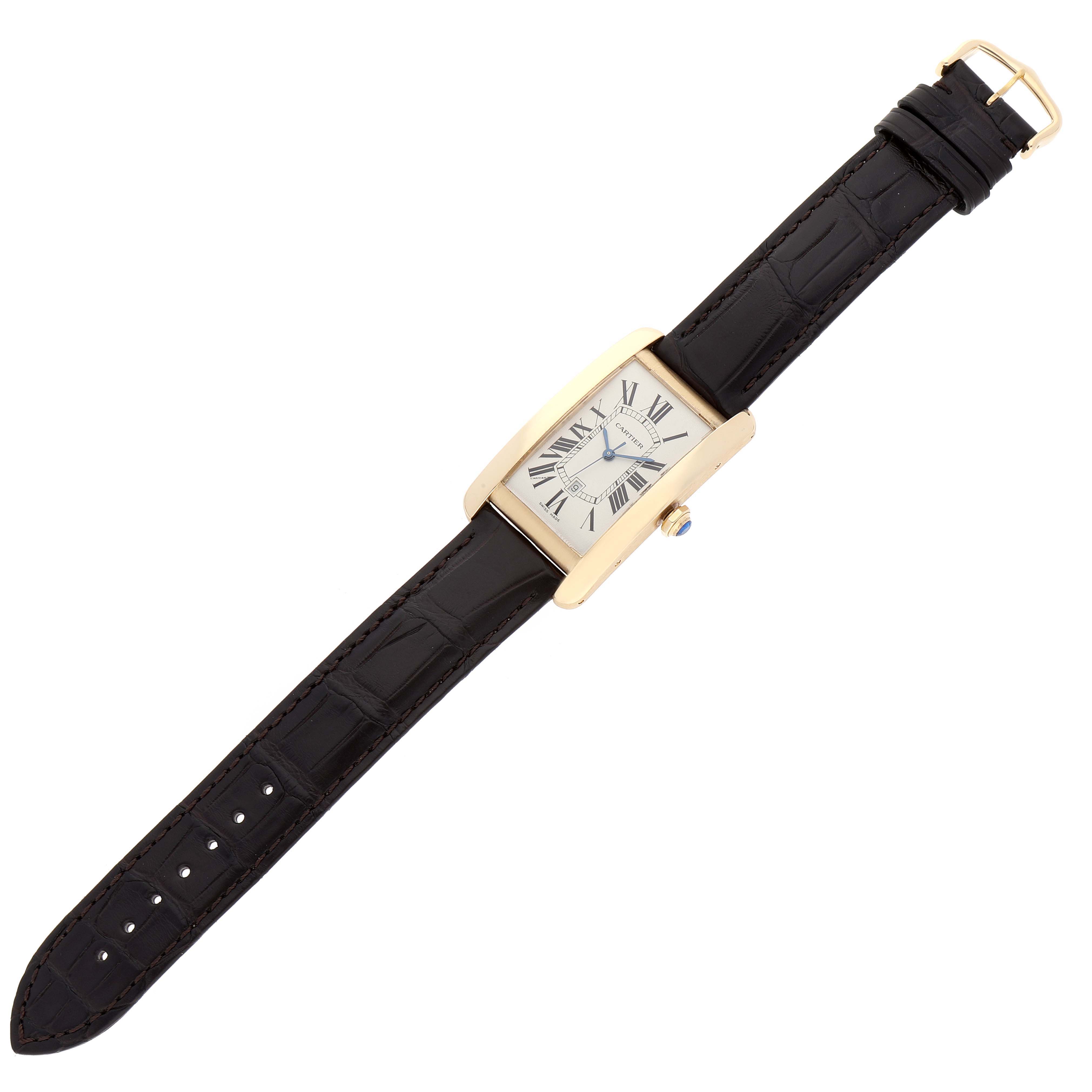 The Cartier Tank Americaine W2603156 Men
s Yellow Gold Silver Dial W2603156 Men
s Yellow Gold Silver Dial watch is shown from a top view, displaying the full face, strap, and clasp.