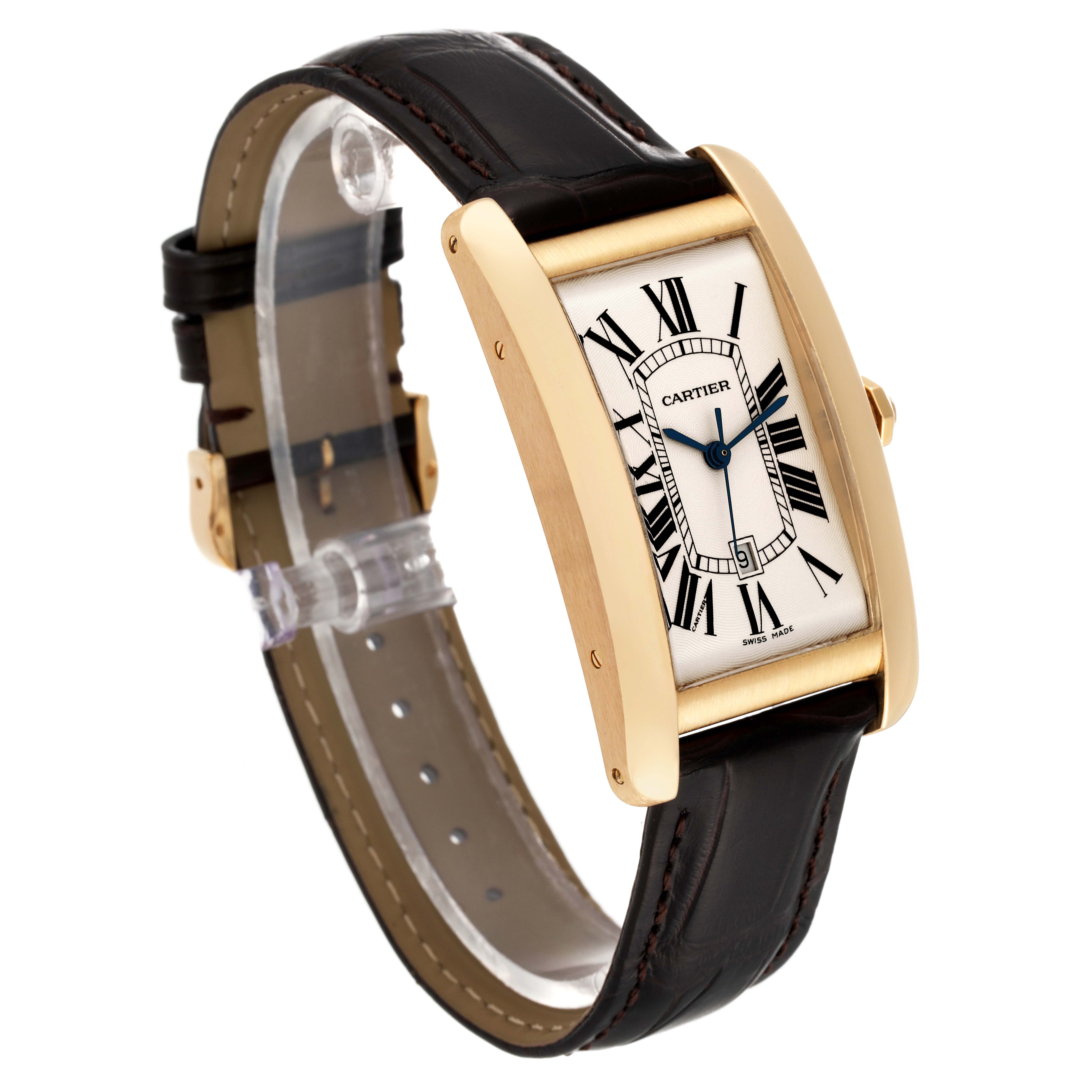 This image shows the Cartier Tank Americaine W2603156 Men
s Yellow Gold Silver Dial W2603156 Men
s Yellow Gold Silver Dial model at an angle highlighting its gold case, Roman numeral dial, and leather strap.