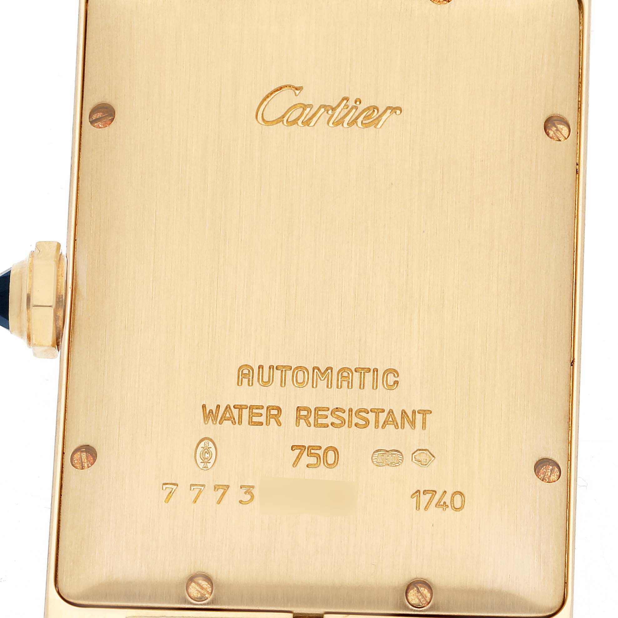 This image shows the back of a Cartier Tank Americaine W2603156 Men's Yellow Gold Silver Dial W2603156 Men's Yellow Gold Silver Dial watch, highlighting its branding and specifications.