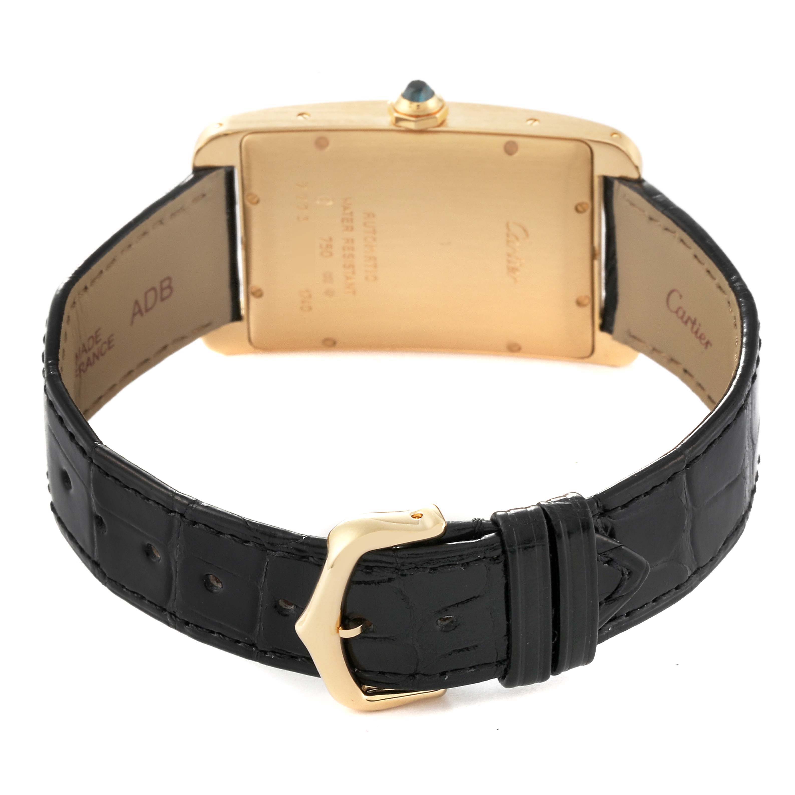 This image shows the back view of the Cartier Tank Americaine W2603156 Men's Yellow Gold Silver Dial W2603156 Men's Yellow Gold Silver Dial watch, highlighting the leather strap and case back.