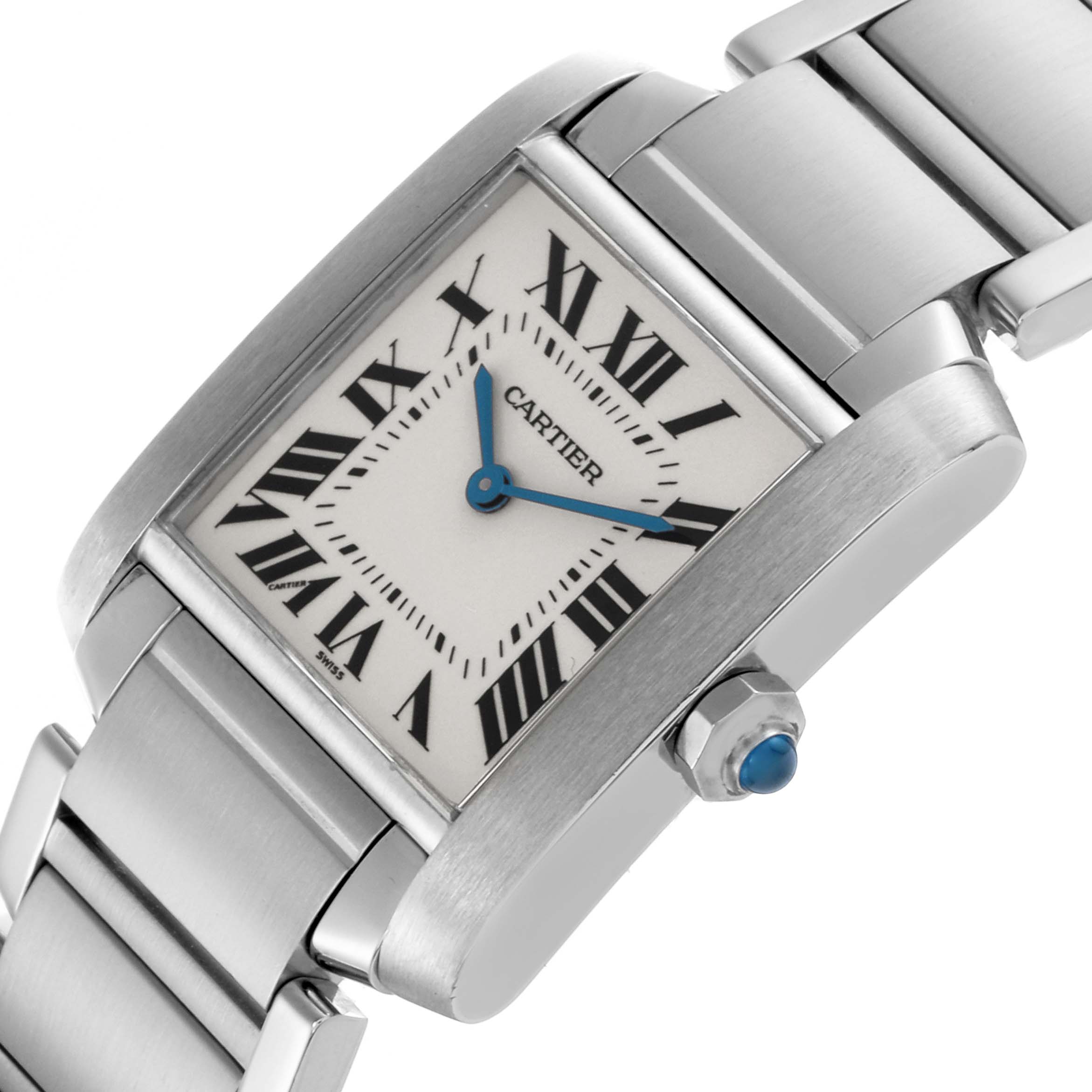 The Cartier Tank Française watch is shown at an angle highlighting the face, bracelet, and blue gemstone crown.