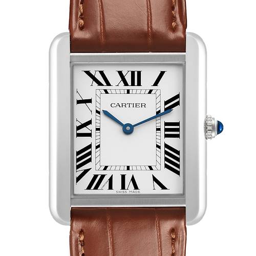 The Cartier Tank Solo WSTA0028 Women's Stainless Steel White Dial watch is shown from the front, highlighting its dial, Roman numerals, blue hands, and brown leather strap.