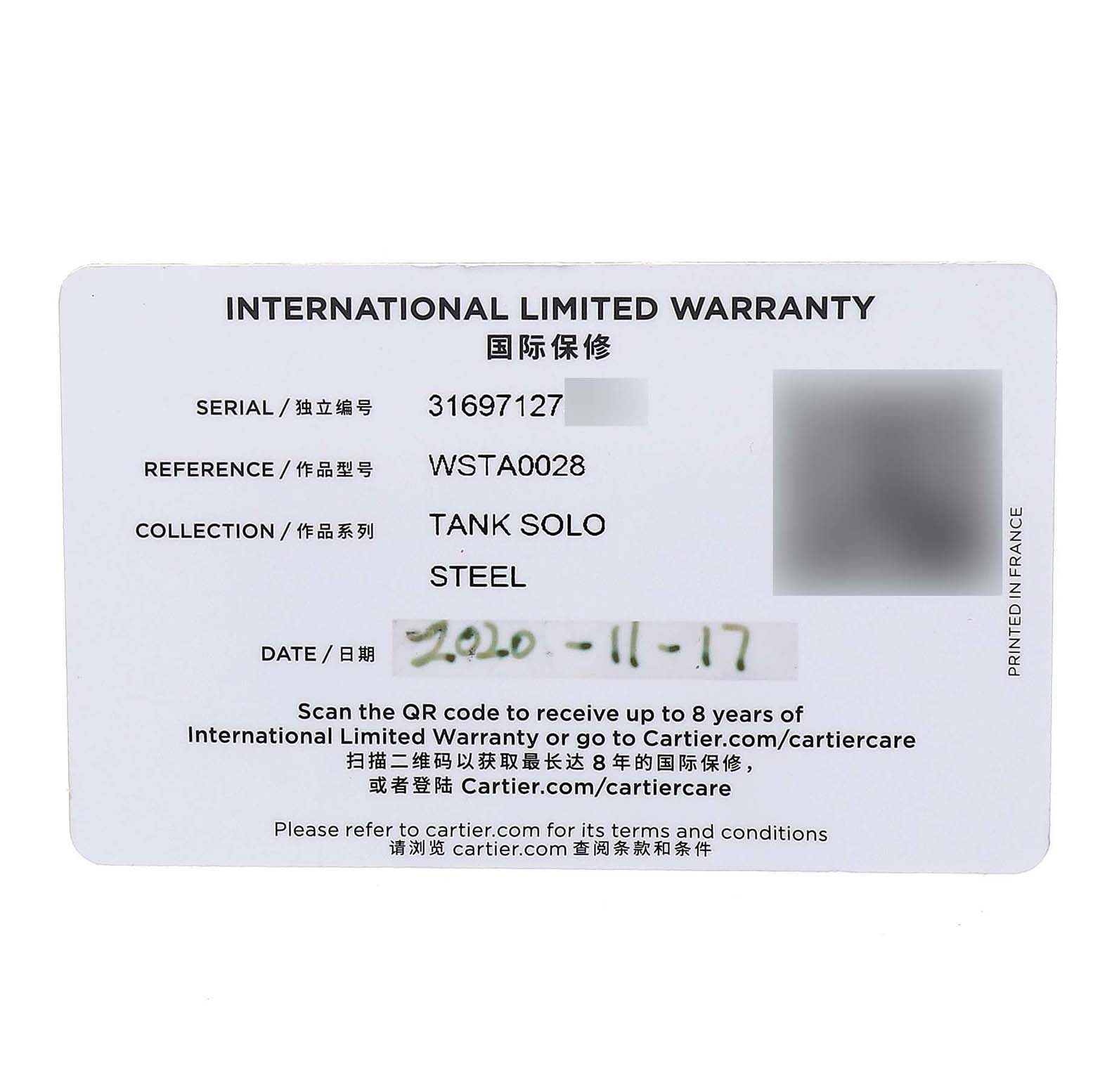 The image shows the warranty card for the Cartier Tank Solo WSTA0028 Women's Stainless Steel White Dial watch.