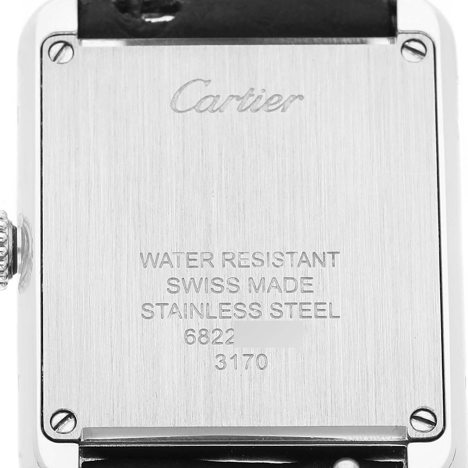 The image shows the back of the Cartier Tank Solo WSTA0030 Women's Stainless Steel Silver Dial watch, highlighting its stainless steel case and engraved details.