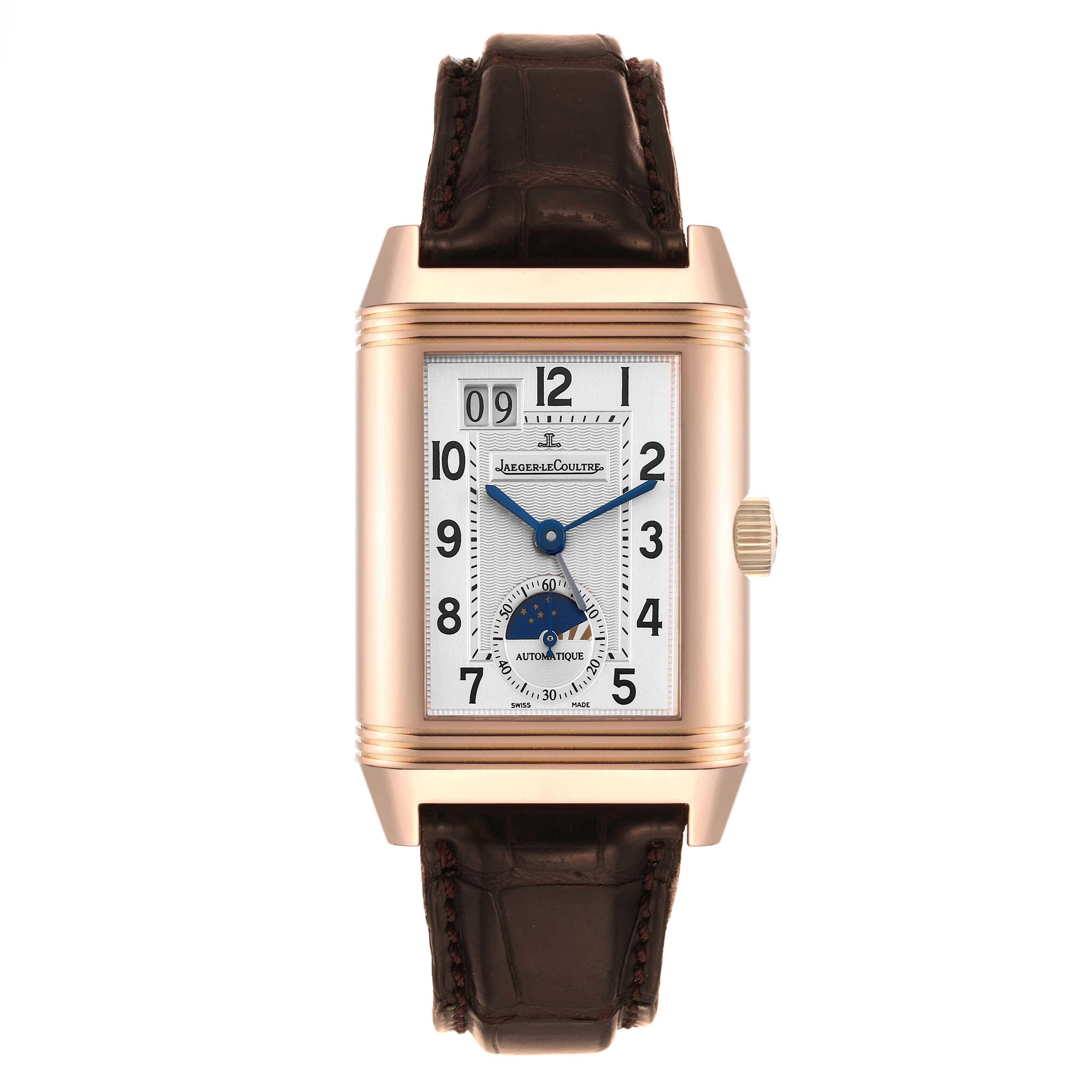 The Jaeger LeCoultre Reverso Q3032420 Men
s Rose Gold Silver Dial Q3032420 Men
s Rose Gold Silver Dial watch is shown from a straight-on angle, displaying the rectangular dial and brown leather strap.