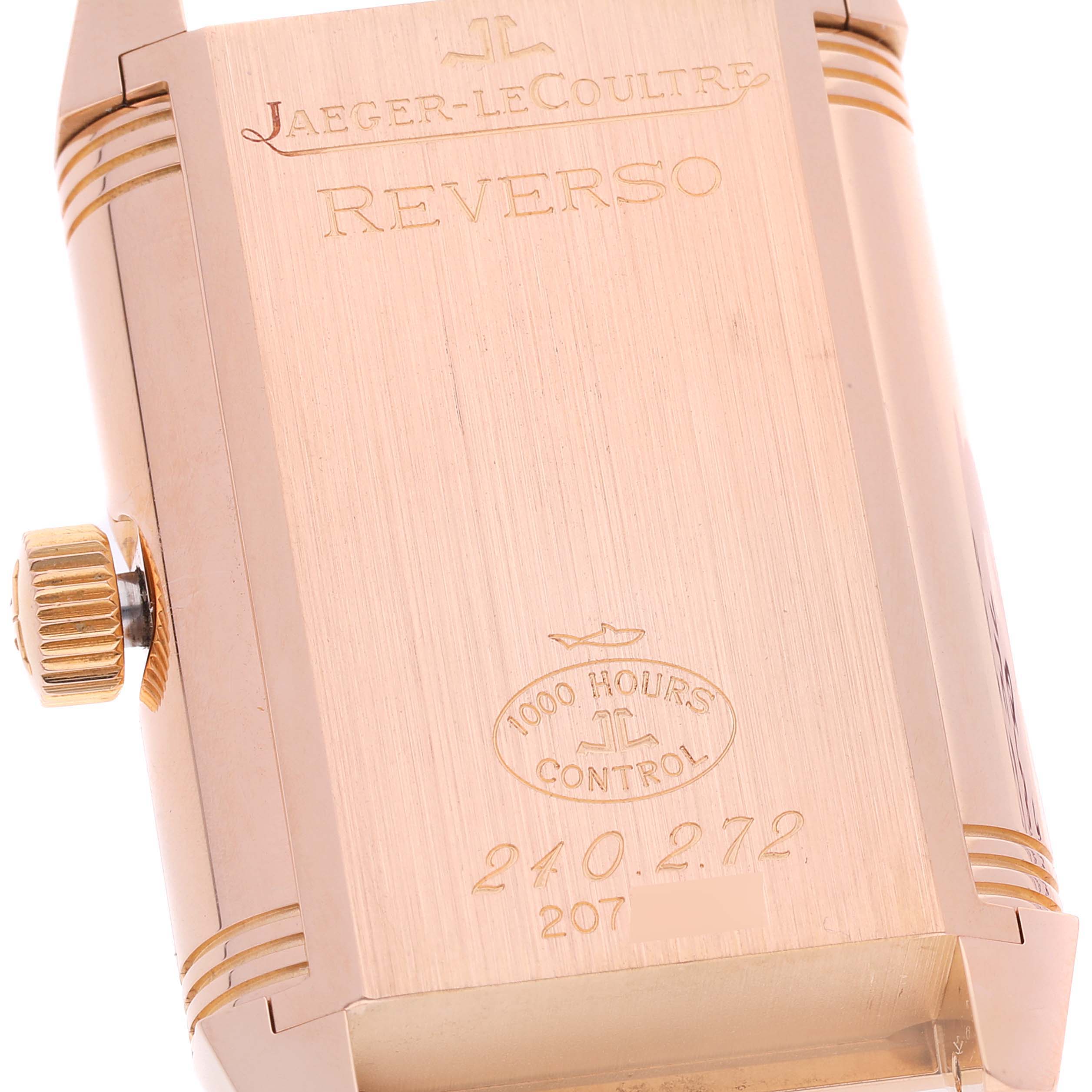 This image shows the case back of a Jaeger LeCoultre Reverso Q3032420 Men
s Rose Gold Silver Dial Q3032420 Men
s Rose Gold Silver Dial watch, highlighting its engravings and crown.