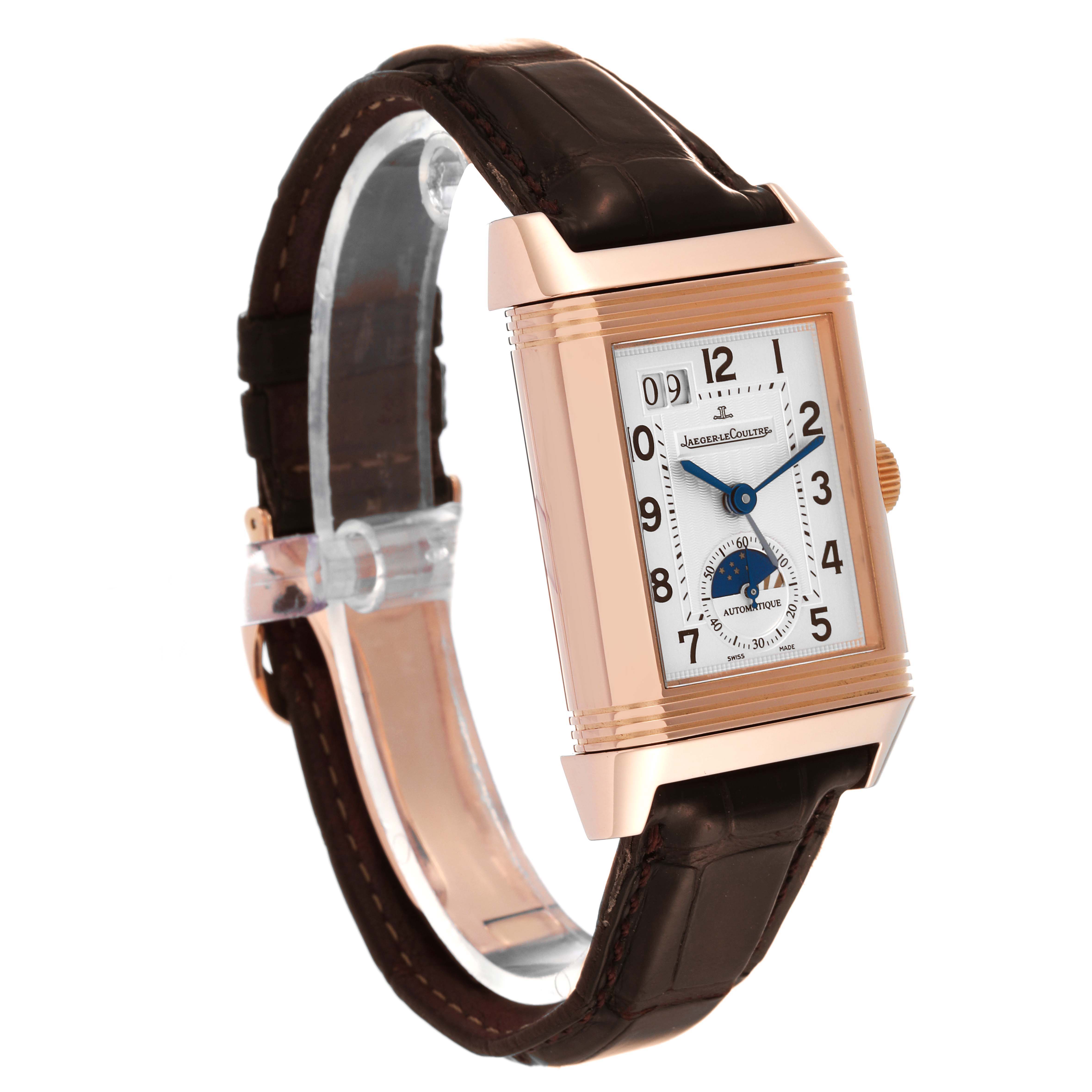 The Jaeger-LeCoultre Reverso watch is shown at a slight angle, displaying the dial, case, lugs, and part of the leather strap.