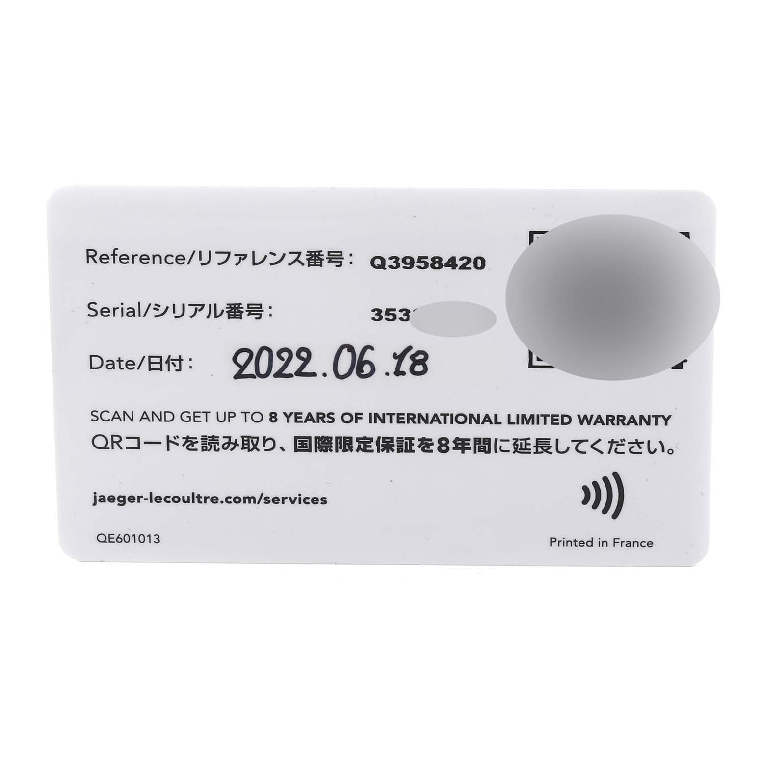 The image shows the top view of a warranty card for the Jaeger-LeCoultre Reverso model watch.