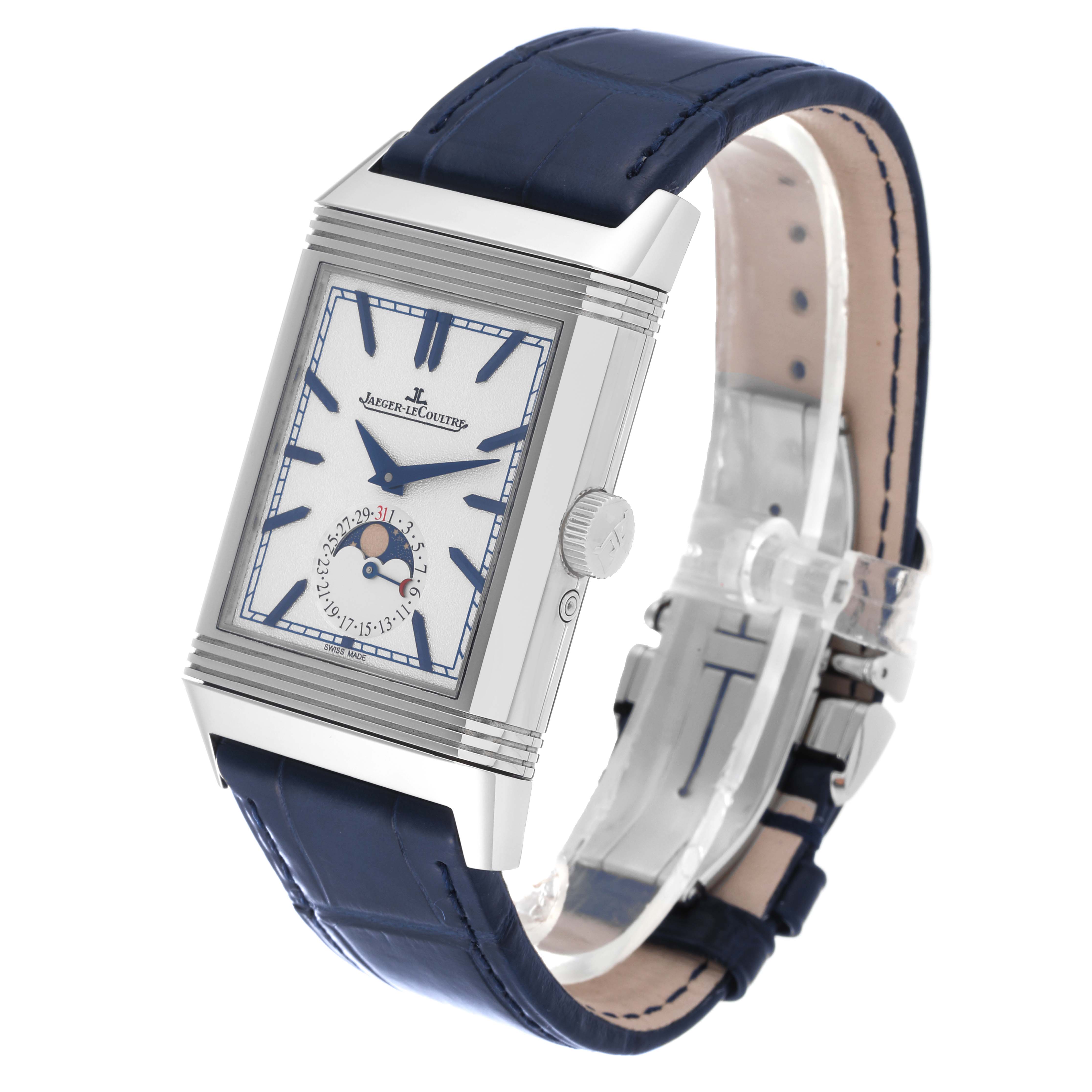 The Jaeger-LeCoultre Reverso watch is shown at a three-quarter angle, highlighting its rectangular face, crown, and blue leather strap.