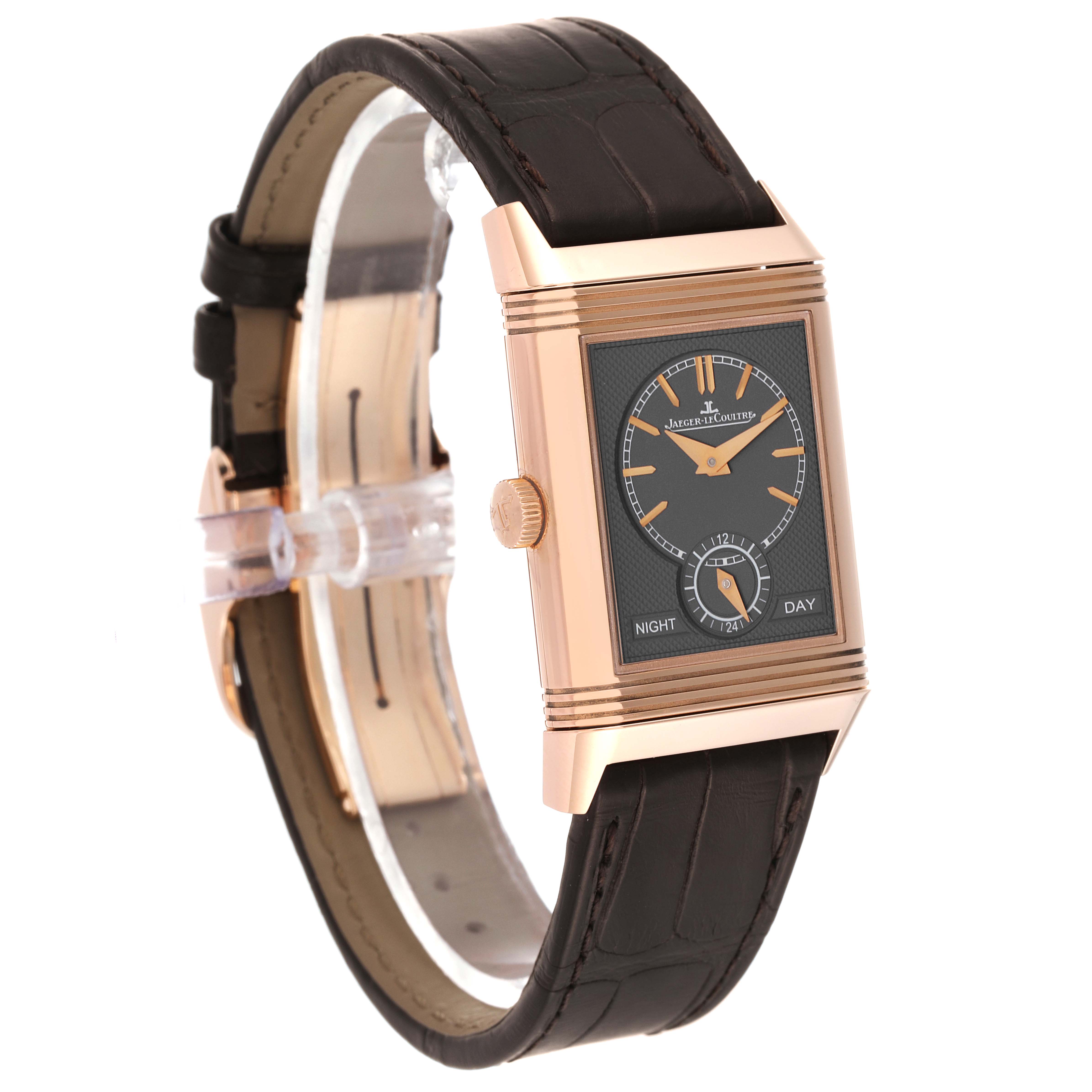 The image shows a side angle view of a Jaeger LeCoultre Reverso Q3902420 Men's Rose Gold Silver Dial Q3902420 Men's Rose Gold Silver Dial watch, highlighting its dial, crown, and leather strap.