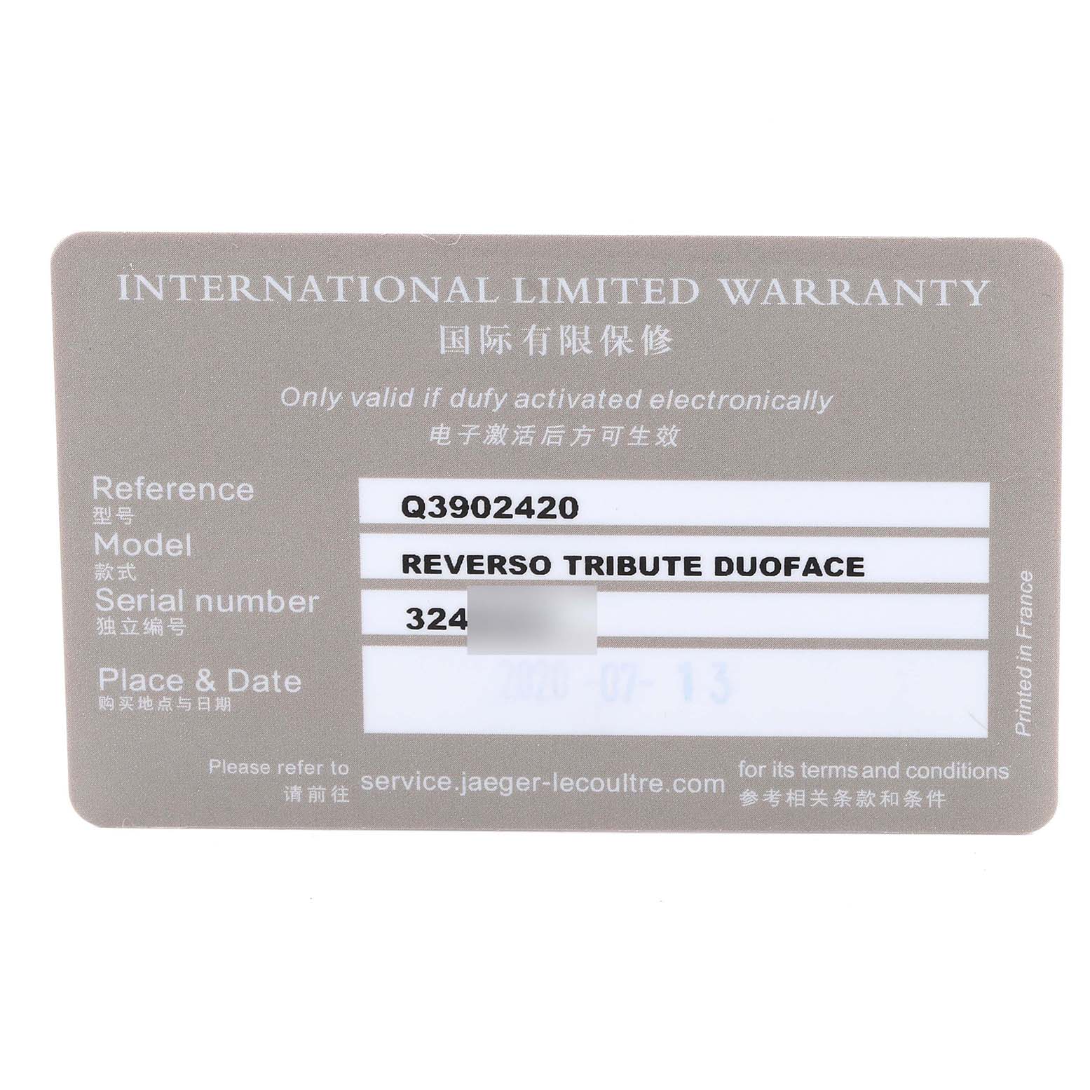 This image shows the international limited warranty card for the Jaeger-LeCoultre Reverso Tribute Duoface model.