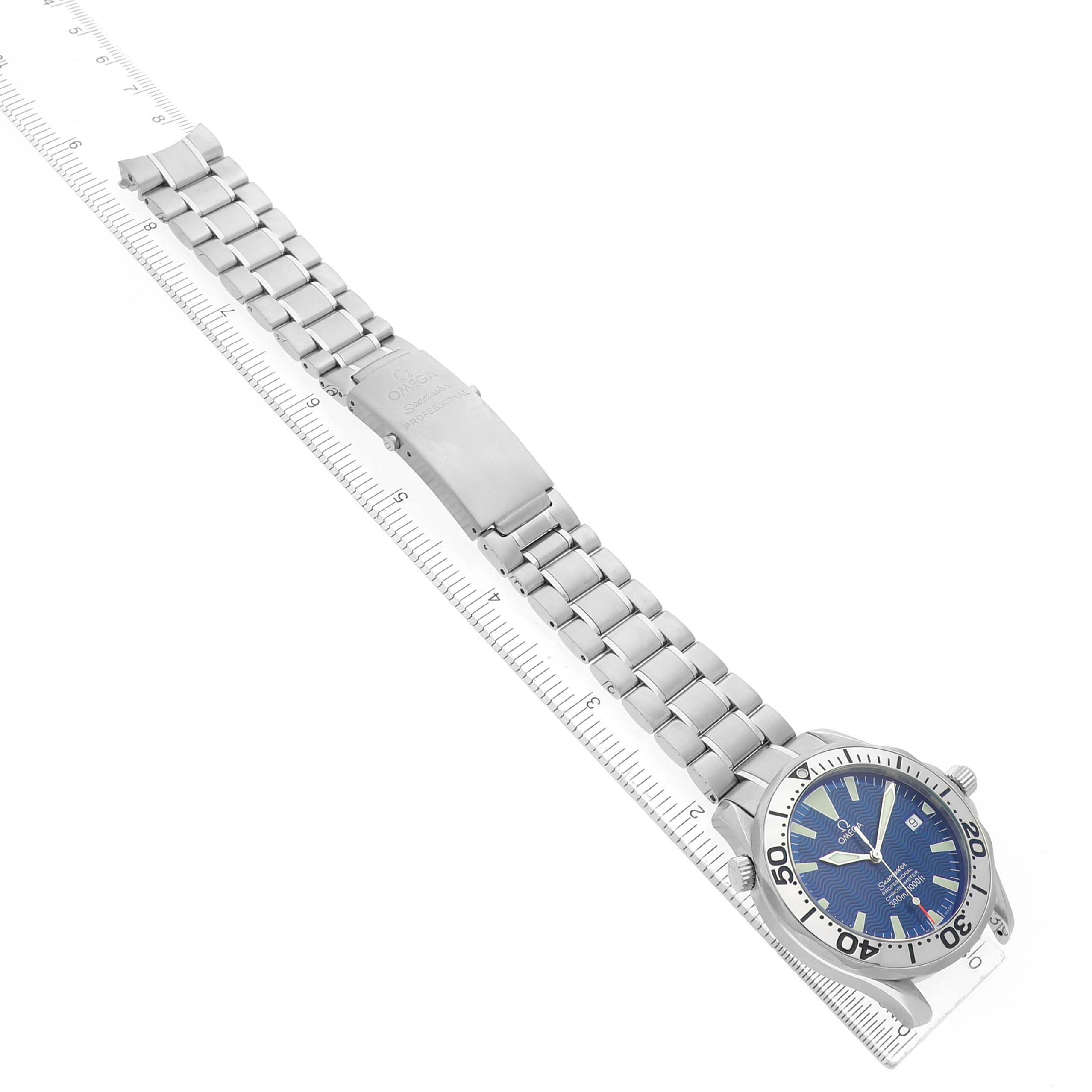 The Omega Seamaster 2255.80.00 Men's Stainless Steel Blue Dial watch is displayed diagonally, showing the face and full metal bracelet alongside a ruler for scale.