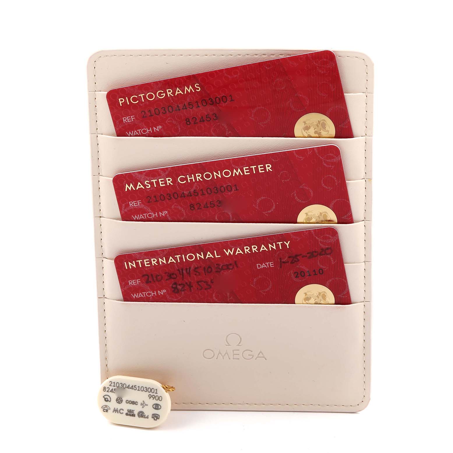 This image shows the Omega Seamaster 210.30.44.51.03.001 Men
s Stainless Steel Blue Dial 210.30.44.51.03.001 Men
s Stainless Steel Blue Dial
s pictograms, master chronometer, and international warranty cards, along with a tag.