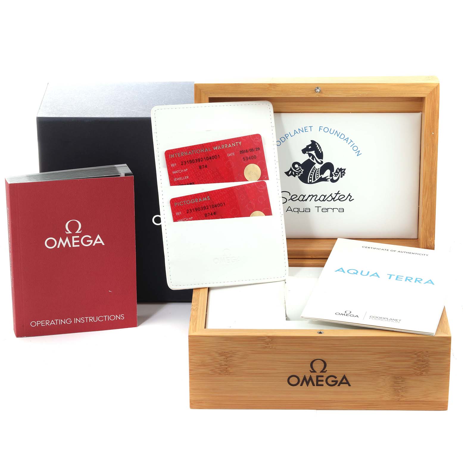 The image shows the packaging and accessories for the Omega Aqua Terra 231.90.39.21.04.001 Men's Titanium White Dial 231.90.39.21.04.001 Men's Titanium White Dial watch, including a manual, warranty cards, and presentation box.