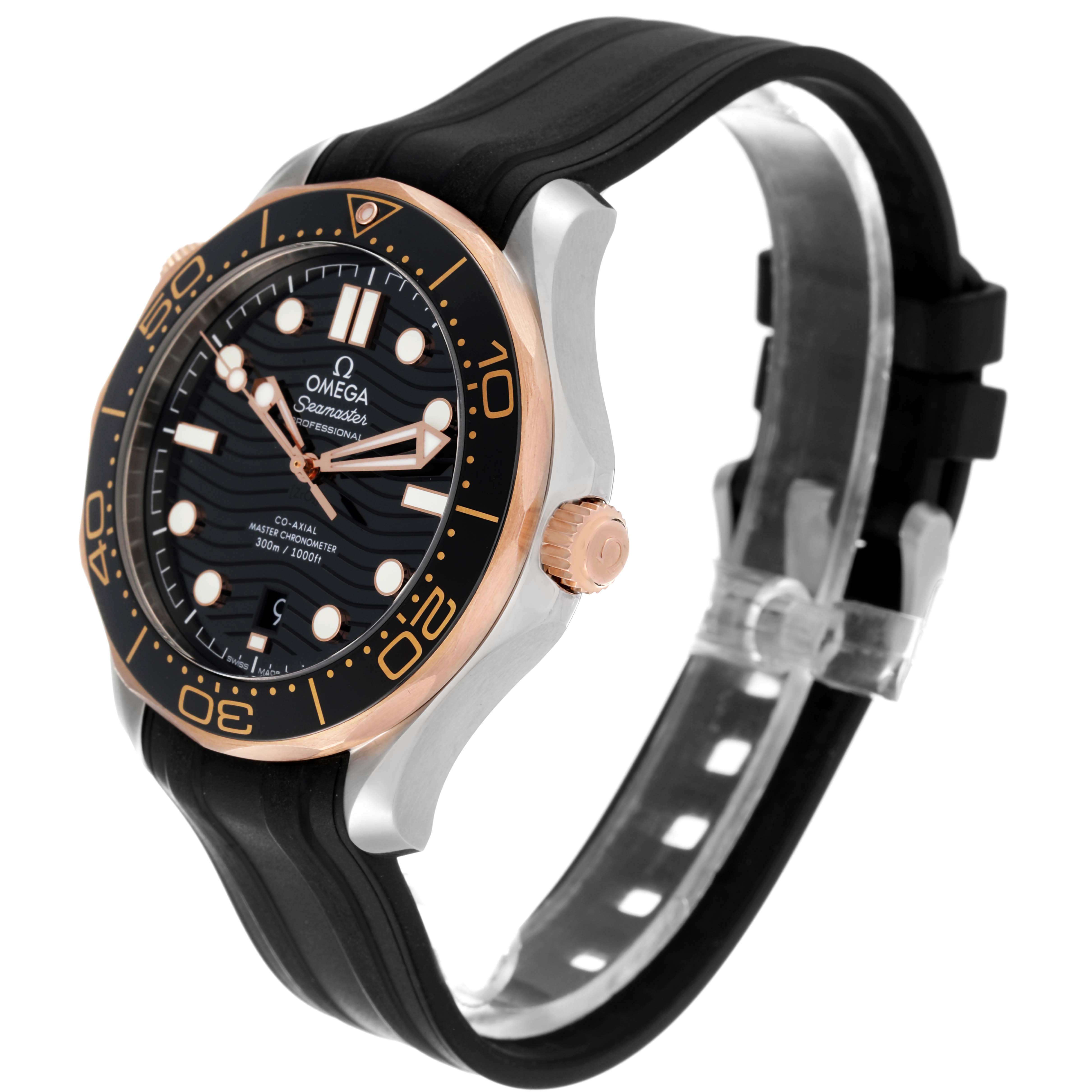 The Omega Seamaster 210.22.42.20.01.002 Men's Steel and Gold (two tone) Black Dial 210.22.42.20.01.002 Men's Steel and Gold (two tone) Black Dial watch is shown at an angle highlighting its black dial, gold bezel, crown, and black rubber strap.