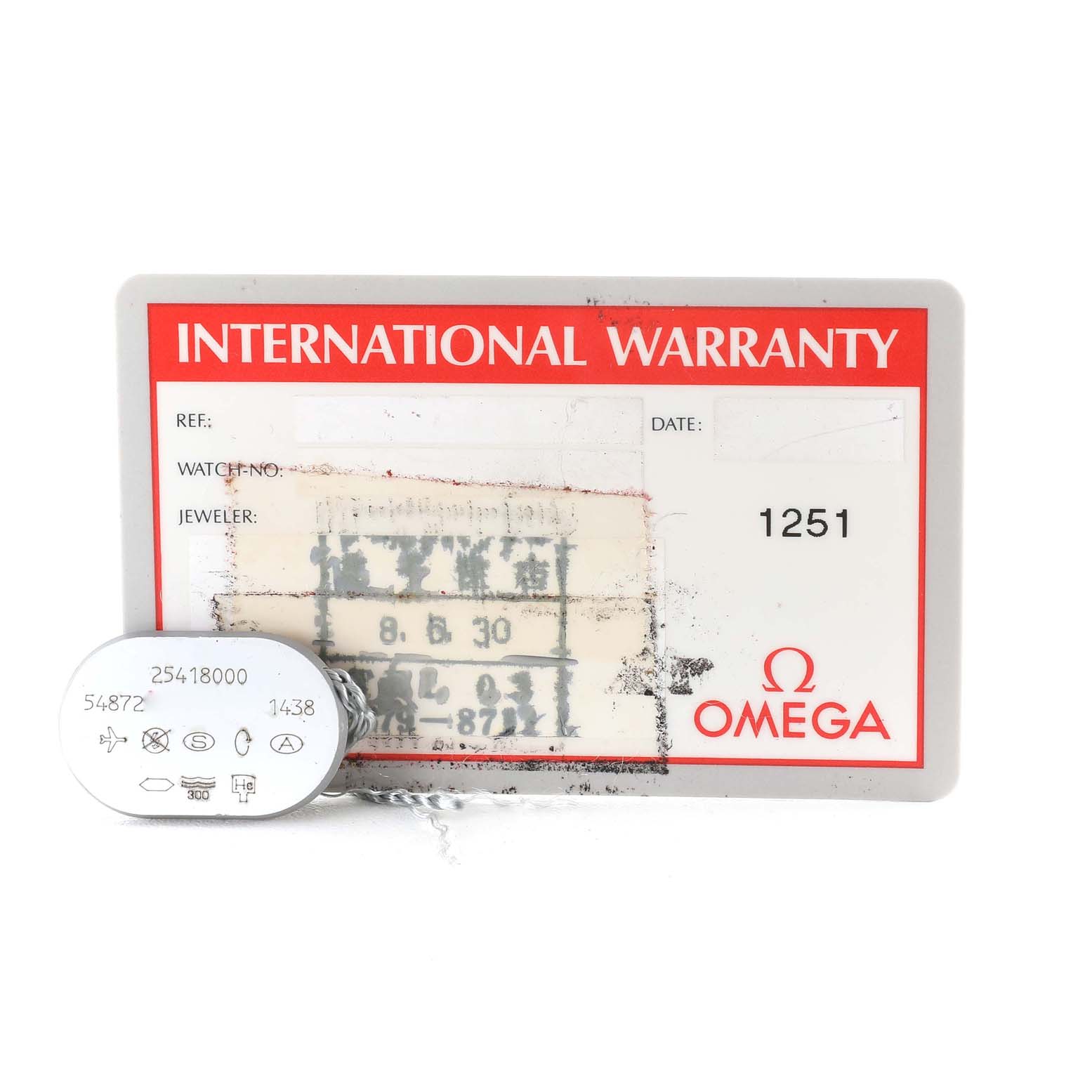 This image shows an Omega Seamaster 2541.80.00 Men
s Stainless Steel Blue Dial 2541.80.00 Men
s Stainless Steel Blue Dial International Warranty card and a tag with reference numbers.