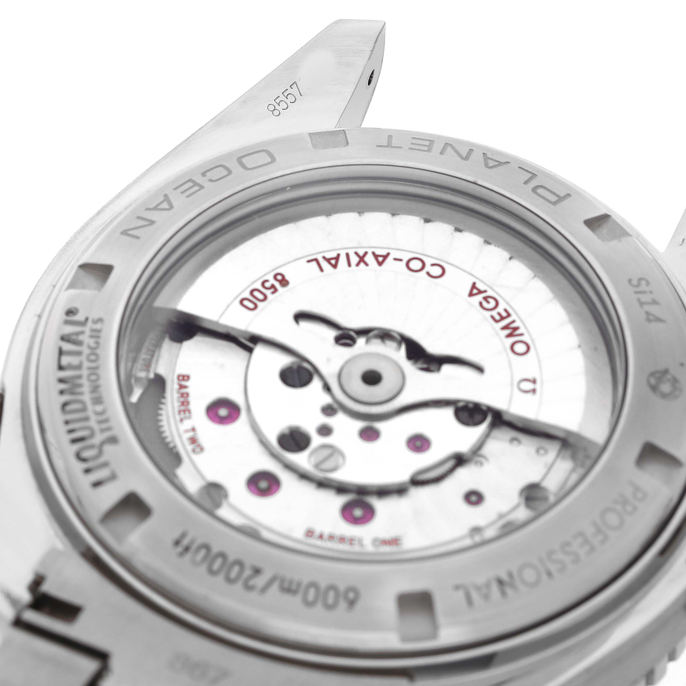 The image shows the back view of an Omega Seamaster 232.90.46.21.03.001 Men's Titanium Blue Dial model, highlighting its movement and Liquidmetal technology.