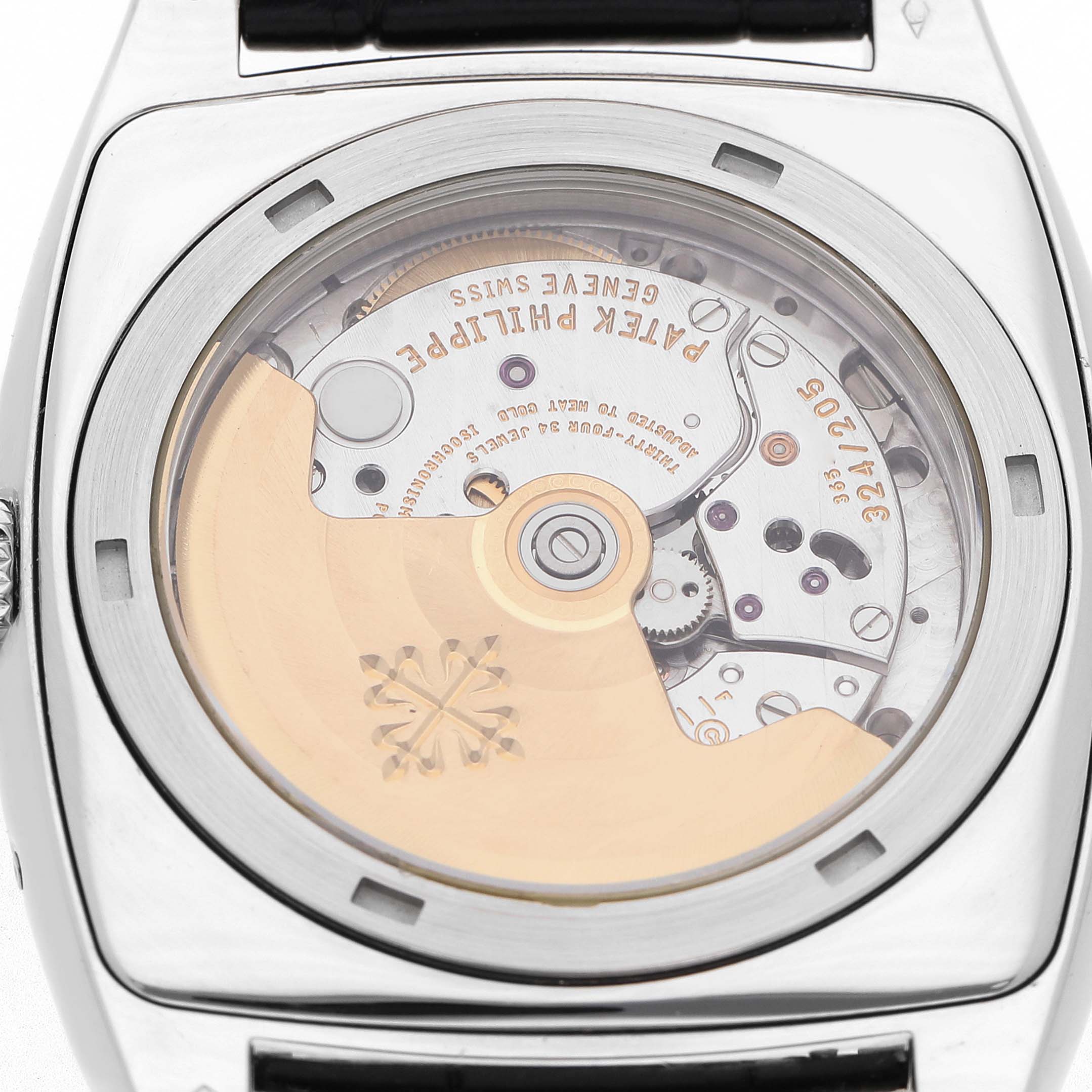 The image shows the back view of a Patek Philippe Gondolo 5135P Men's Platinum Grey Dial, highlighting its movement mechanism through a transparent case back.