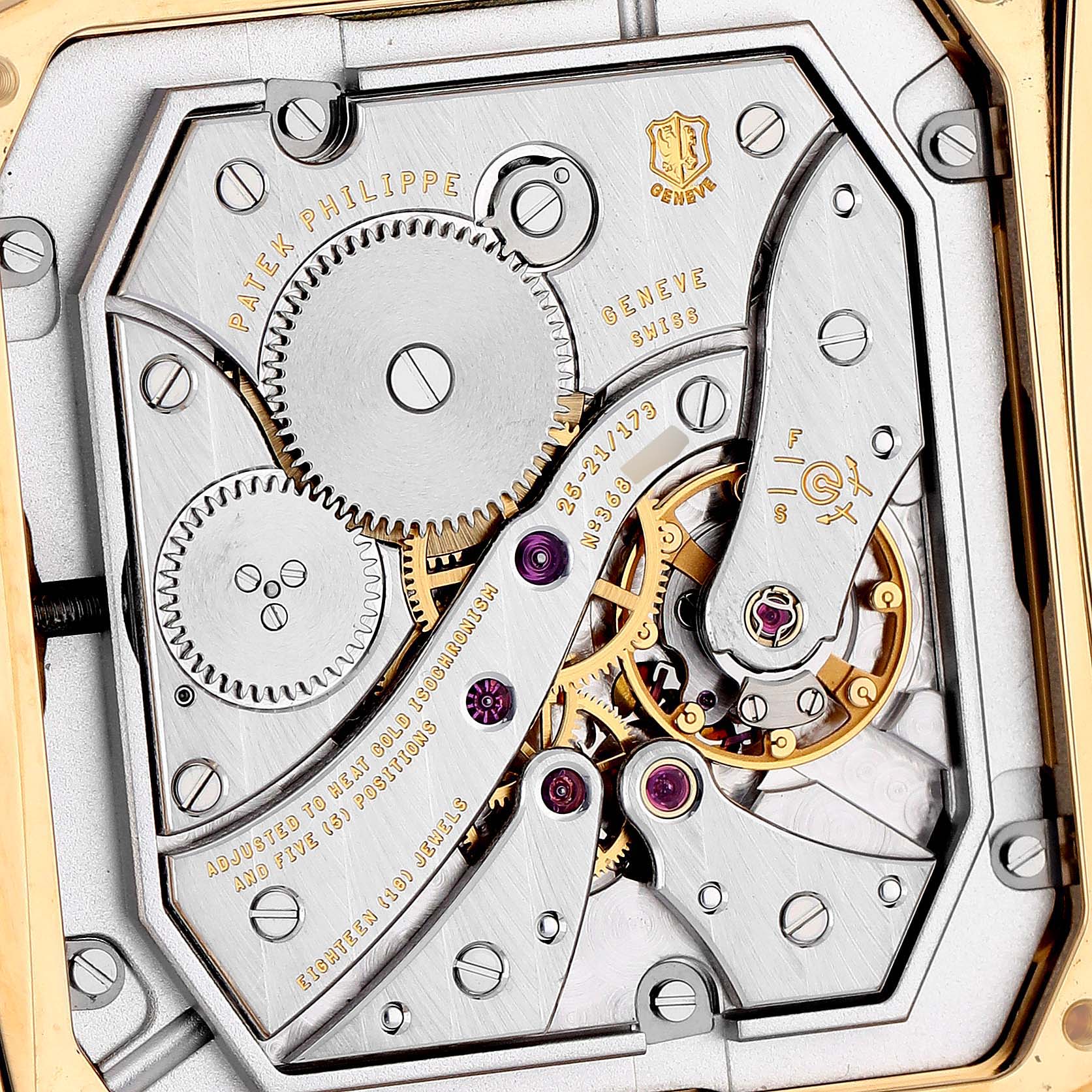 The image shows the movement of a Patek Philippe Gondolo 5124J-001 Men's Yellow Gold Silver Dial watch from a back angle, highlighting gears and components.