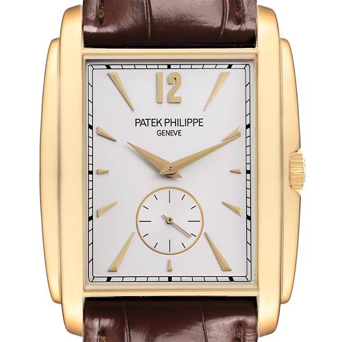 The image shows a Patek Philippe Gondolo 5124J-001 Men's Yellow Gold Silver Dial watch from the front, highlighting its rectangular face, gold hands, and brown leather strap.