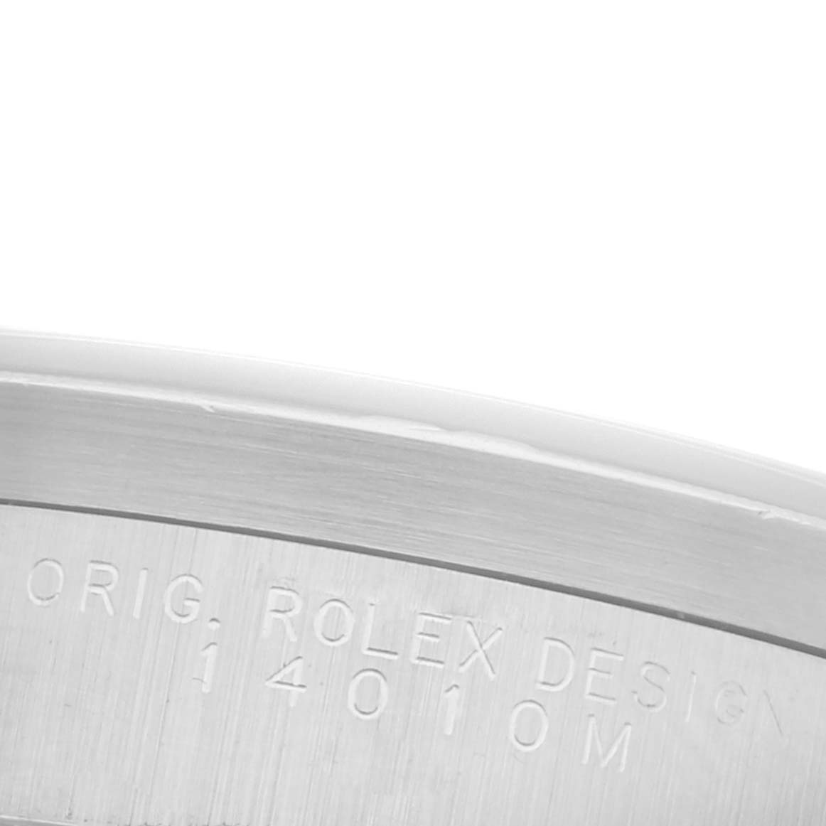 The image shows the engraved side of the Rolex Datejust model, displaying the model number and branding.