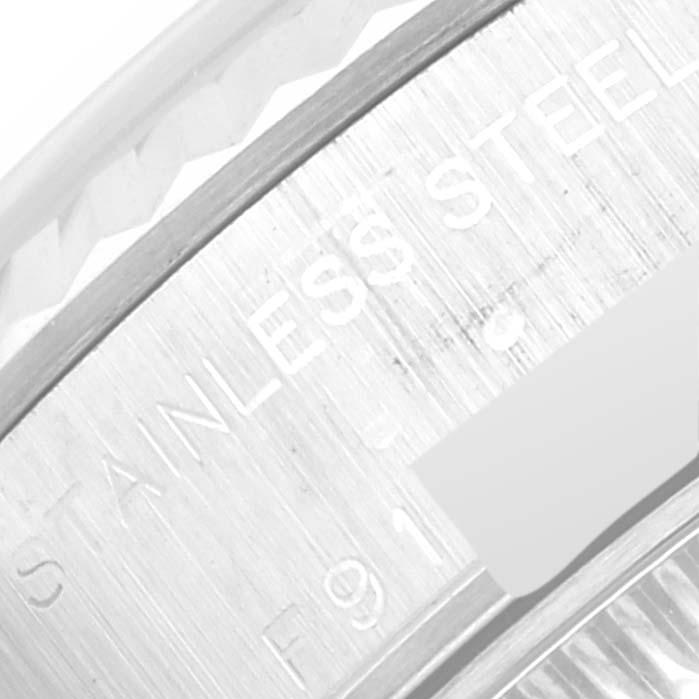 This close-up image shows part of the bezel and stainless steel markings on a Rolex Datejust 79174 Women's Stainless Steel Silver Dial 79174 Women's Stainless Steel Silver Dial watch.