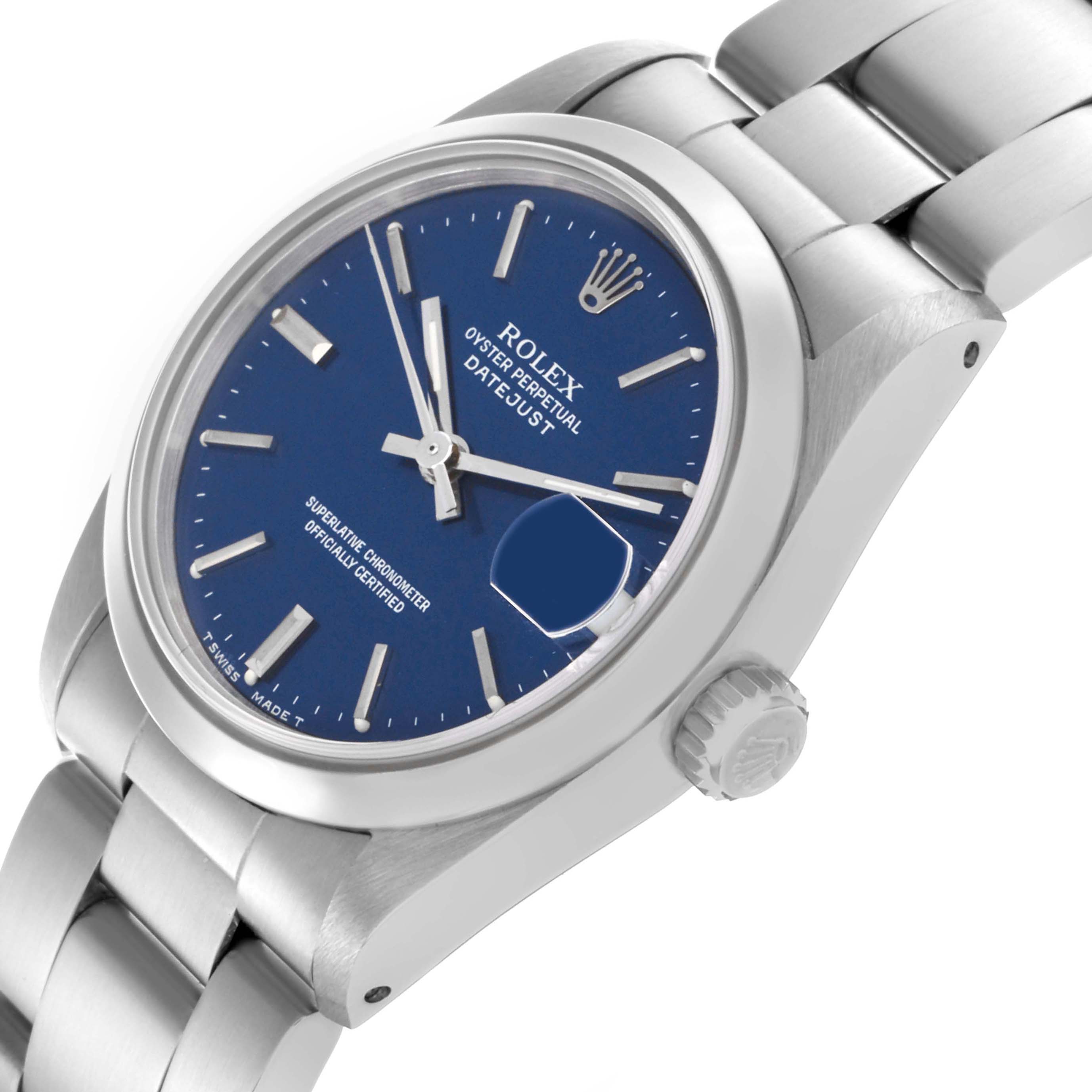 The Rolex Mid-Size 68240 Women's Stainless Steel Blue Dial 68240 Women's Stainless Steel Blue Dial Datejust watch is shown at an angled side view, revealing the face, bezel, crown, and part of the bracelet.