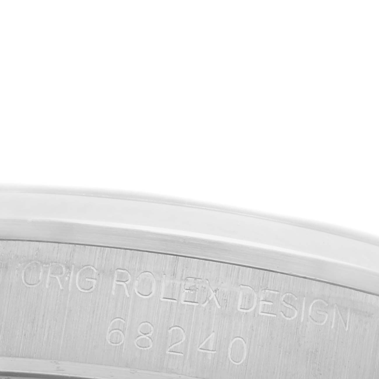 The image shows a close-up of the inner rim of a Rolex Mid-Size 68240 Women's Stainless Steel Blue Dial 68240 Women's Stainless Steel Blue Dial watch, displaying the engraved model number and branding.