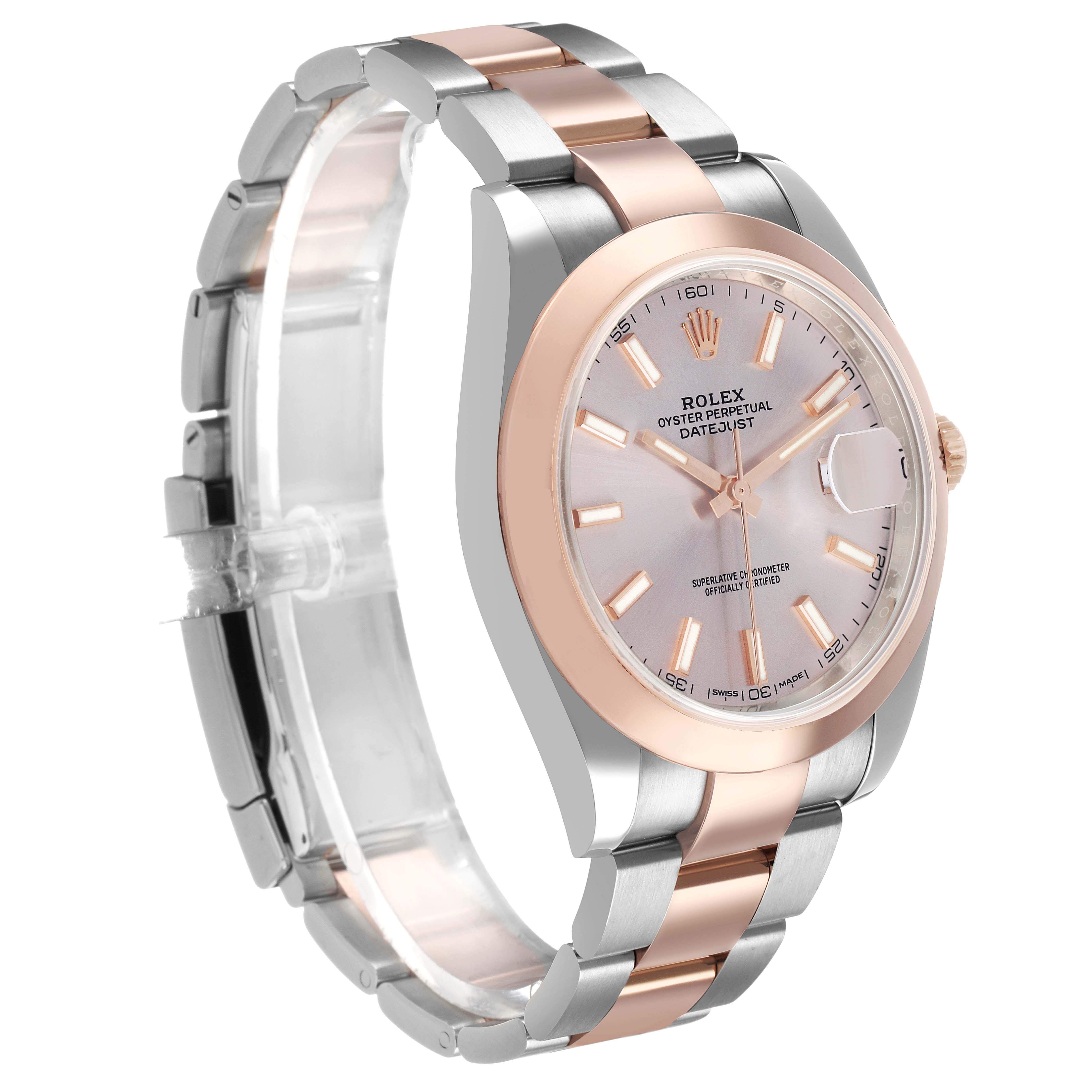 The Rolex Datejust 126301 Men's Steel and Gold (two tone) Pink Dial watch is shown at a three-quarter angle, highlighting its dial, bezel, and two-tone bracelet.