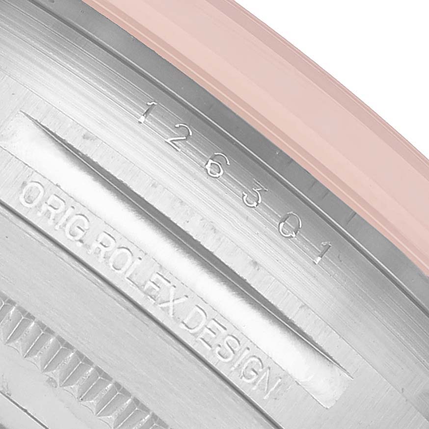 The image shows the side of a Rolex Datejust 126301 Men's Steel and Gold (two tone) Pink Dial watch case with engraved text and design markings.