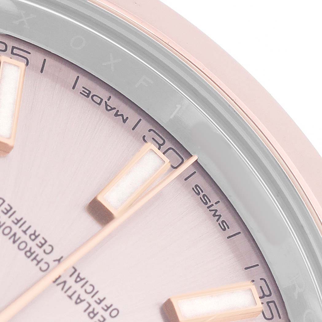 The image shows a close-up of the dial and markers of a Rolex Datejust 126301 Men's Steel and Gold (two tone) Pink Dial, focusing on the 25–35 minute markers.