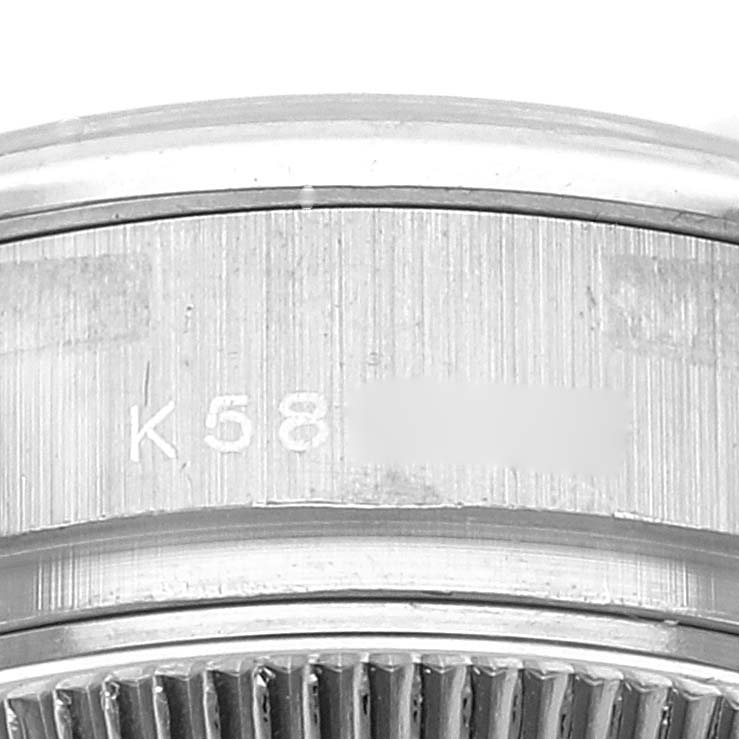 This image shows a close-up of the case back edge and the serial number of a Rolex President 179296 Women's Platinum Silver Dial 179296 Women's Platinum Silver Dial model watch.