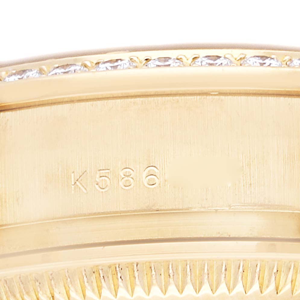 This close-up image shows the serial number engraving and diamond-set bezel of a Rolex President 179138 Women
s Yellow Gold Champagne Dial 179138 Women
s Yellow Gold Champagne Dial model watch.