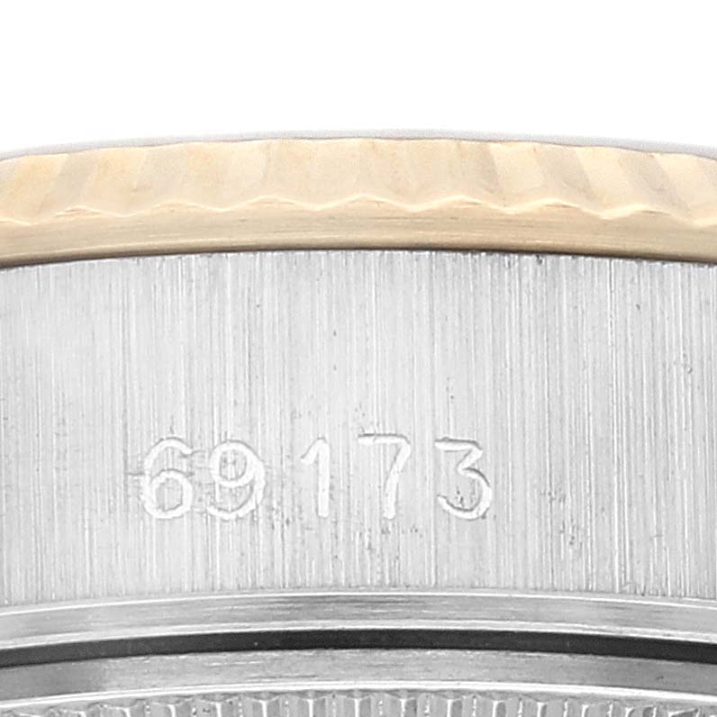 This close-up image of the Rolex Datejust 69173 Women's Steel and Gold (two tone) Silver Dial 69173 Women's Steel and Gold (two tone) Silver Dial watch shows the model number "69173" and part of the fluted bezel.