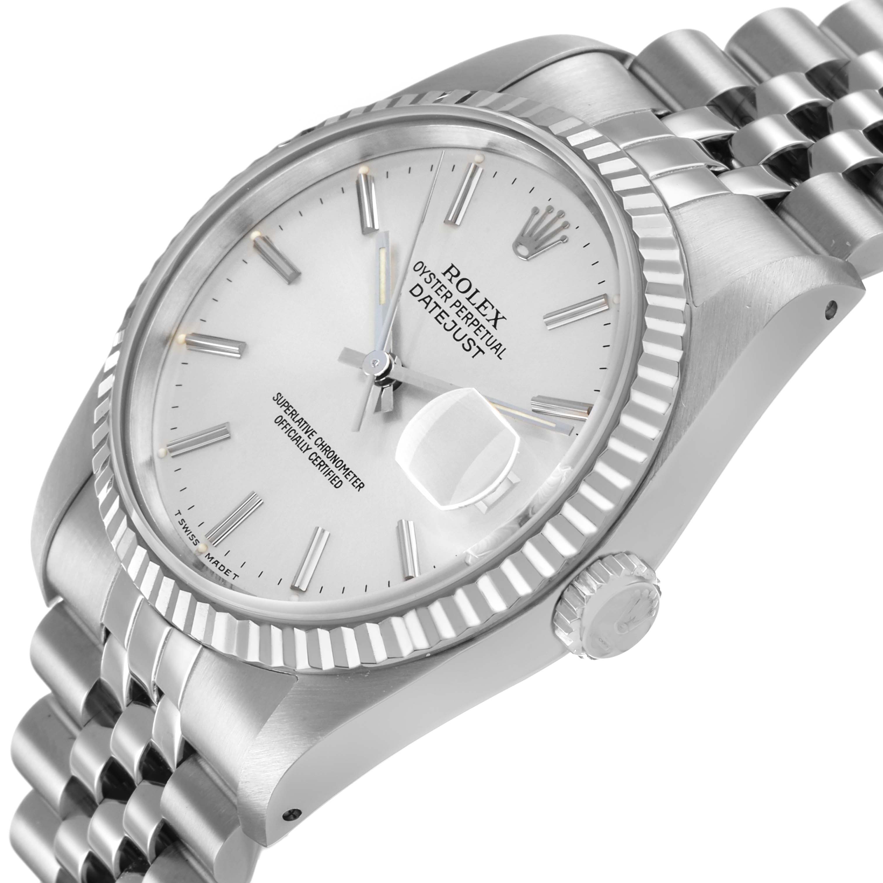 The Rolex Datejust 16234 Men's Stainless Steel Silver Dial watch is shown at an angle highlighting the dial, fluted bezel, and part of the bracelet.
