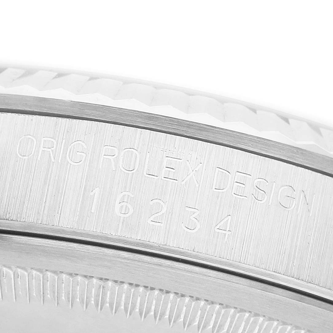 The image shows a close-up of the side of a Rolex Datejust 16234 Men's Stainless Steel Silver Dial, highlighting the engraved model number and "Orig Rolex Design" text.