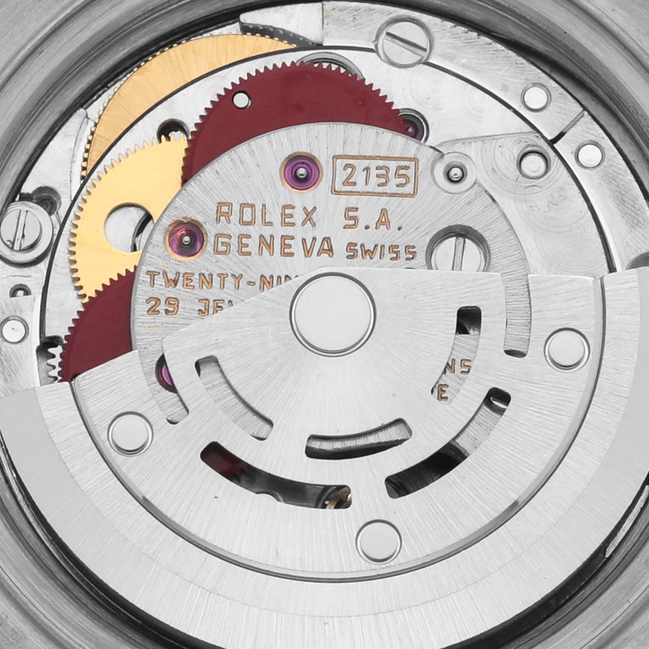 The image shows the intricate movement mechanism inside a Rolex Datejust 69173 Women's Steel and Gold (two tone) Black Dial 69173 Women's Steel and Gold (two tone) Black Dial, highlighting gears and inscriptions.