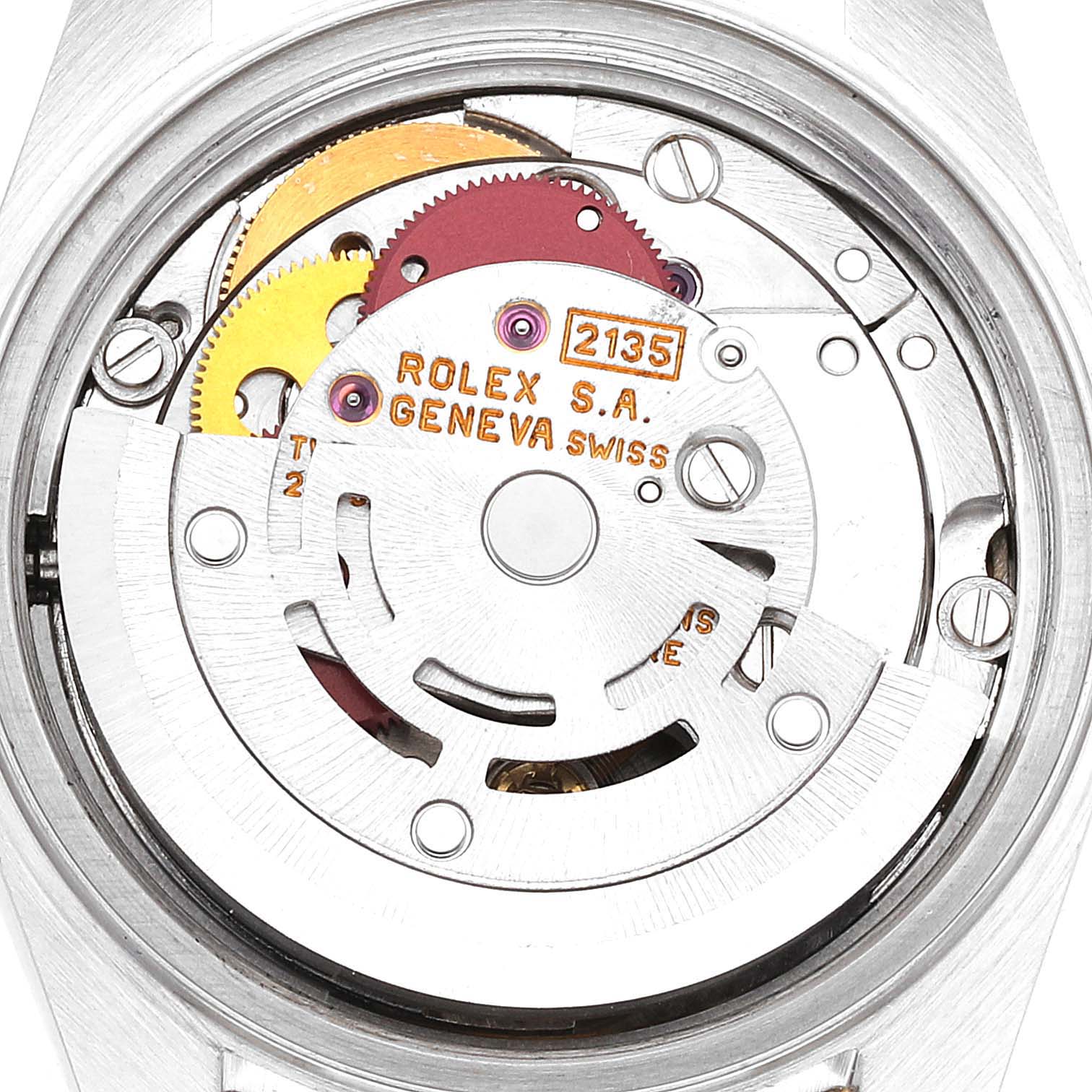 This image shows the inner mechanical movement of a Rolex Datejust 69173 Women's Steel and Gold (two tone) Champagne Dial 69173 Women's Steel and Gold (two tone) Champagne Dial watch from a rear angle, highlighting its gears and engravings.