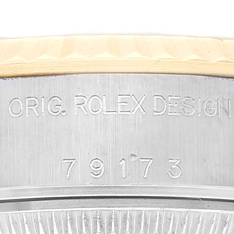 This image shows a close-up of the model number engraving on the side of a Rolex Datejust 79173 Women's Steel and Gold (two tone) Champagne Dial 79173 Women's Steel and Gold (two tone) Champagne Dial watch case.