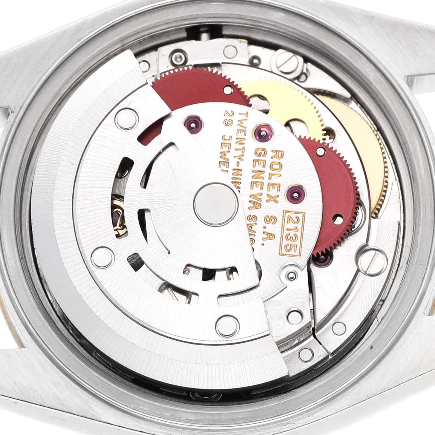 The image shows the movement of a Rolex Datejust 69173 Women's Steel and Gold (two tone) Champagne Dial, highlighting gears and mechanisms from the back angle.