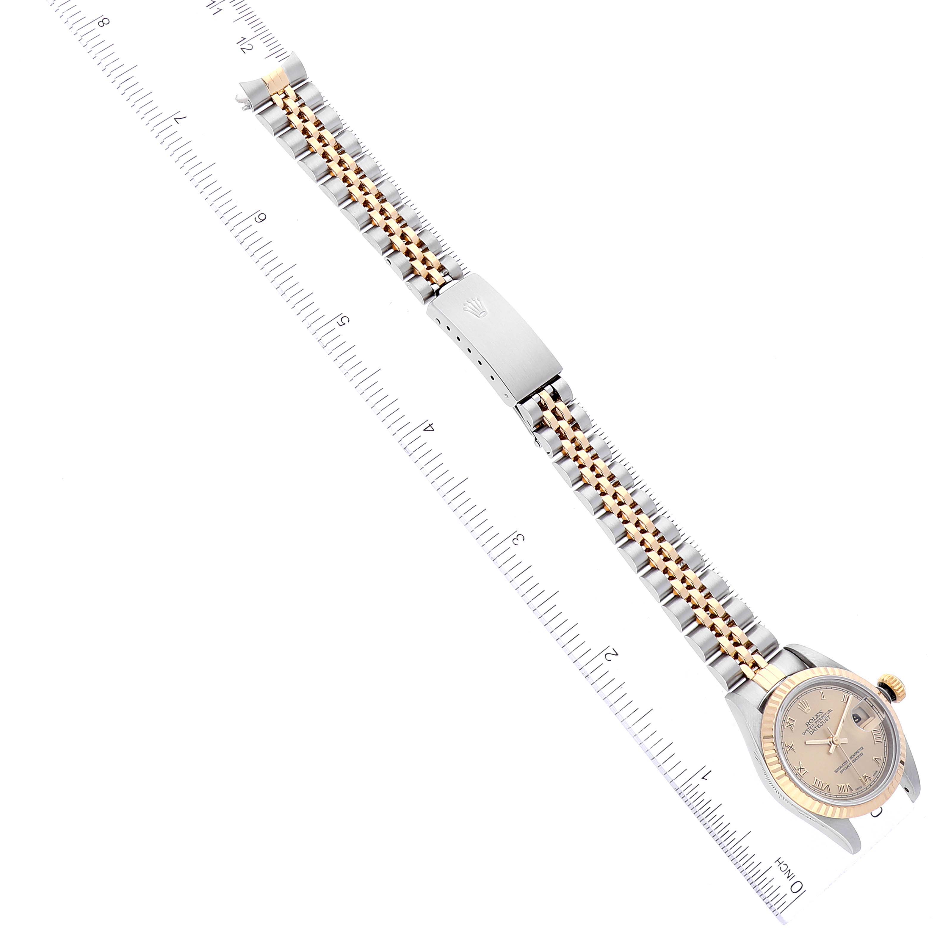 The image shows a top-down view of a Rolex Datejust 79173 Women's Steel and Gold (two tone) Champagne Dial 79173 Women's Steel and Gold (two tone) Champagne Dial watch with its bracelet fully extended and aligned with a ruler for measurement.