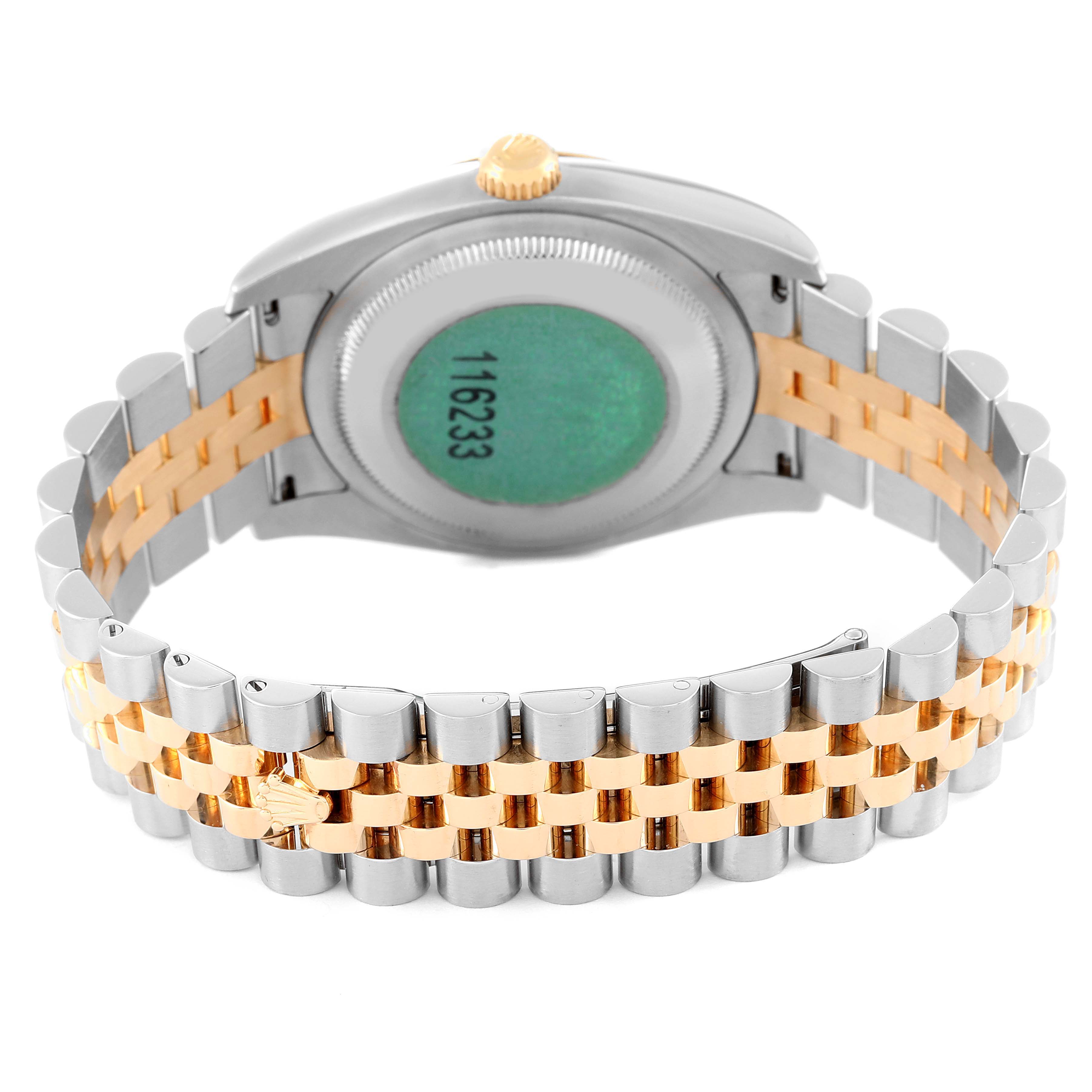 The image shows the back view of a Rolex Datejust 116233 Men's Steel and Gold (two tone) Silver Dial 116233 Men's Steel and Gold (two tone) Silver Dial with a two-tone (gold and silver) bracelet and its case back.