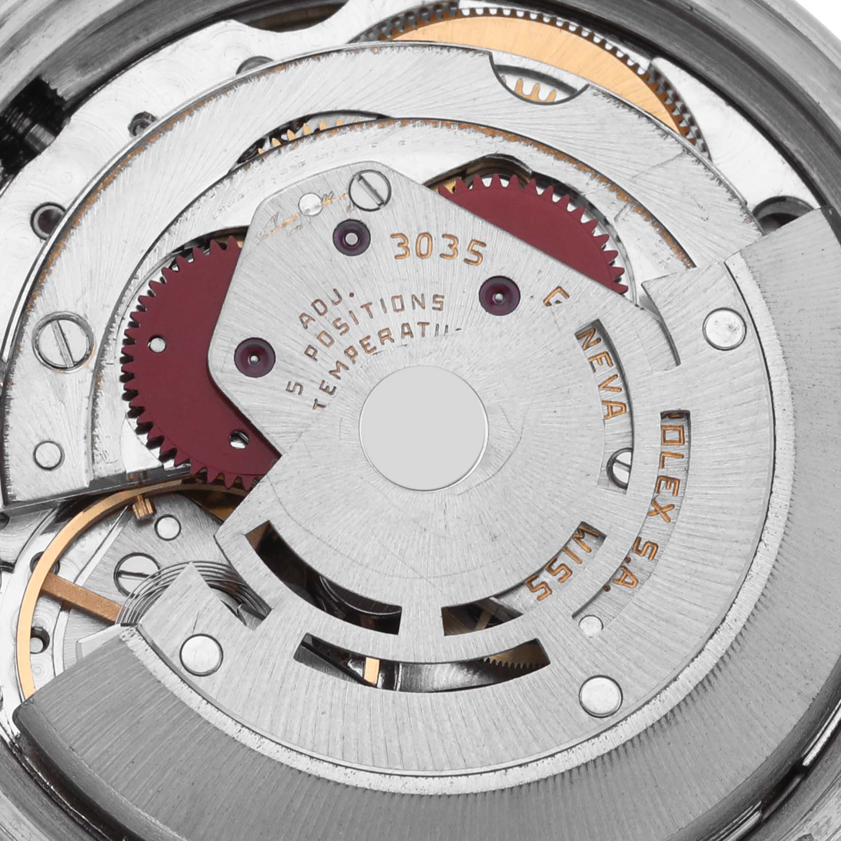 The image shows a close-up view of the Rolex Datejust 16013 Men's Steel and Gold (two tone) Champagne Dial 16013 Men's Steel and Gold (two tone) Champagne Dial movement, focusing on the rotor and gears.