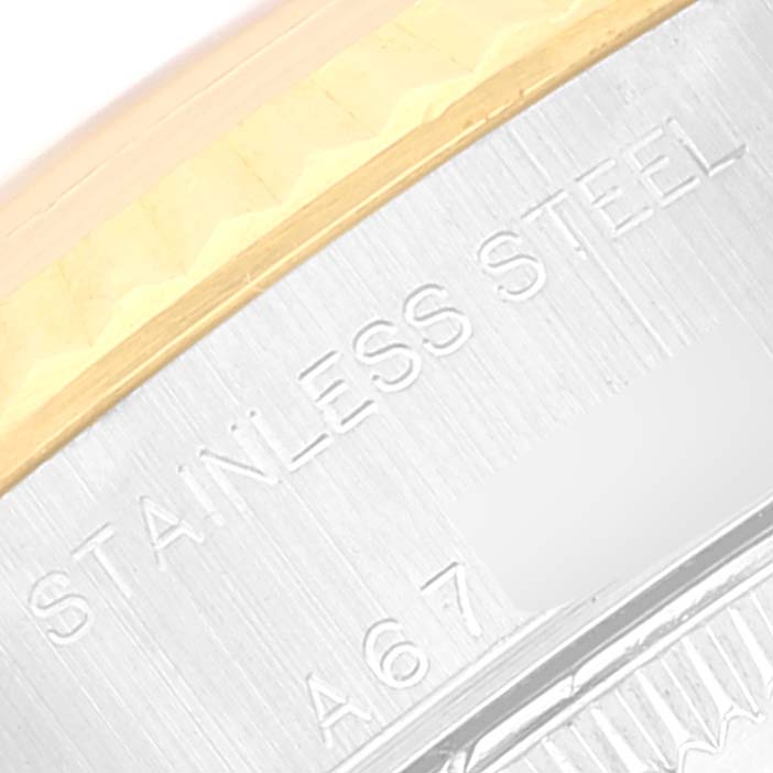 This image shows a close-up of the side of a Rolex Datejust 79173 Women's Steel and Gold (two tone) Silver Dial 79173 Women's Steel and Gold (two tone) Silver Dial watch with the "STAINLESS STEEL" marking.