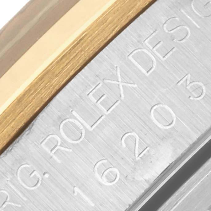 The image shows a close-up of the side of a Rolex Datejust 16203 Men's Steel and Gold (two tone) Grey Dial 16203 Men's Steel and Gold (two tone) Grey Dial, highlighting its bezel edge and engraved model details.