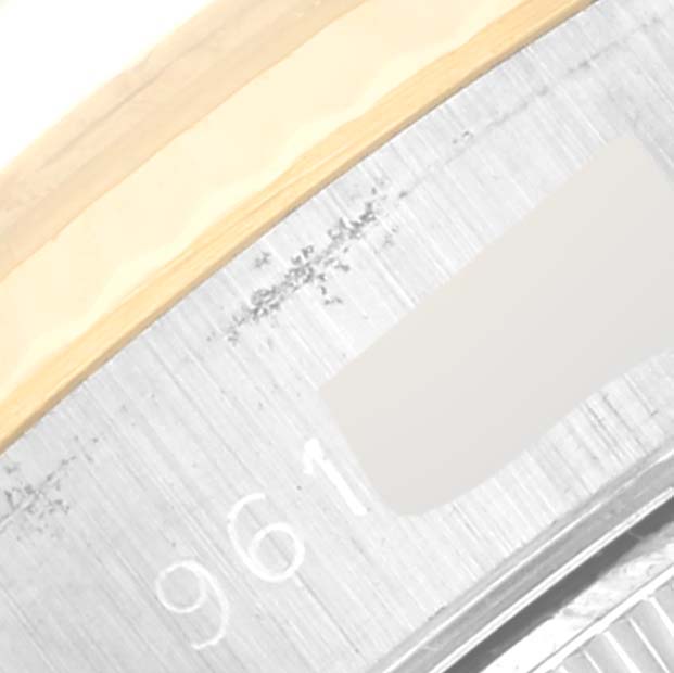 This close-up image shows the partial serial number on the case side of a Rolex Datejust 69173 Women's Steel and Gold (two tone) Champagne Dial 69173 Women's Steel and Gold (two tone) Champagne Dial watch.