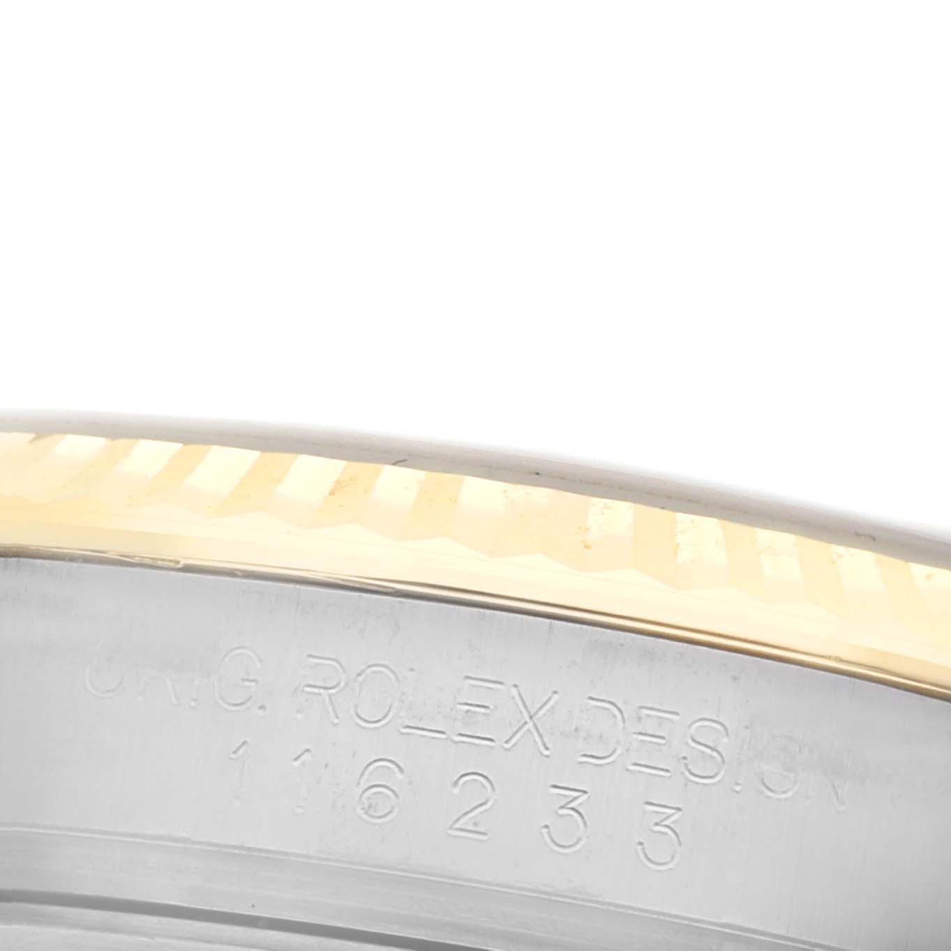 The image shows a close-up of the side of the Rolex Datejust 116233 Men's Steel and Gold (two tone) White Dial 116233 Men's Steel and Gold (two tone) White Dial, highlighting the engraved design and fluted bezel.
