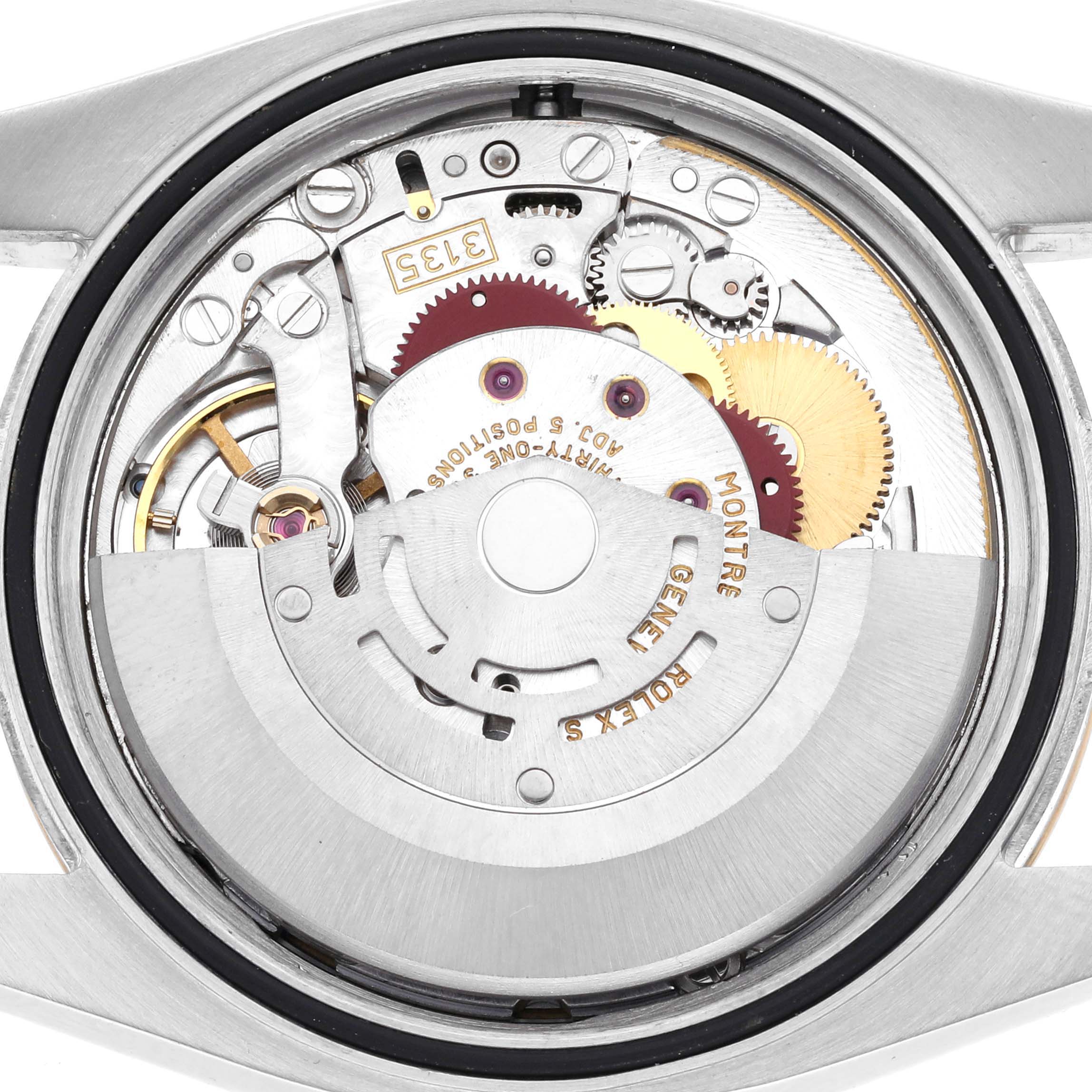 The image shows the movement mechanism of a Rolex Datejust 116233 Men's Steel and Gold (two tone) White Dial 116233 Men's Steel and Gold (two tone) White Dial watch from a top-down angle.