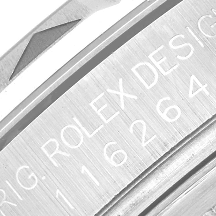 The image shows an angled close-up of the engraved model number on the bezel of a Rolex Turn-o-Graph 116264 Men's Stainless Steel Black Dial 116264 Men's Stainless Steel Black Dial watch.